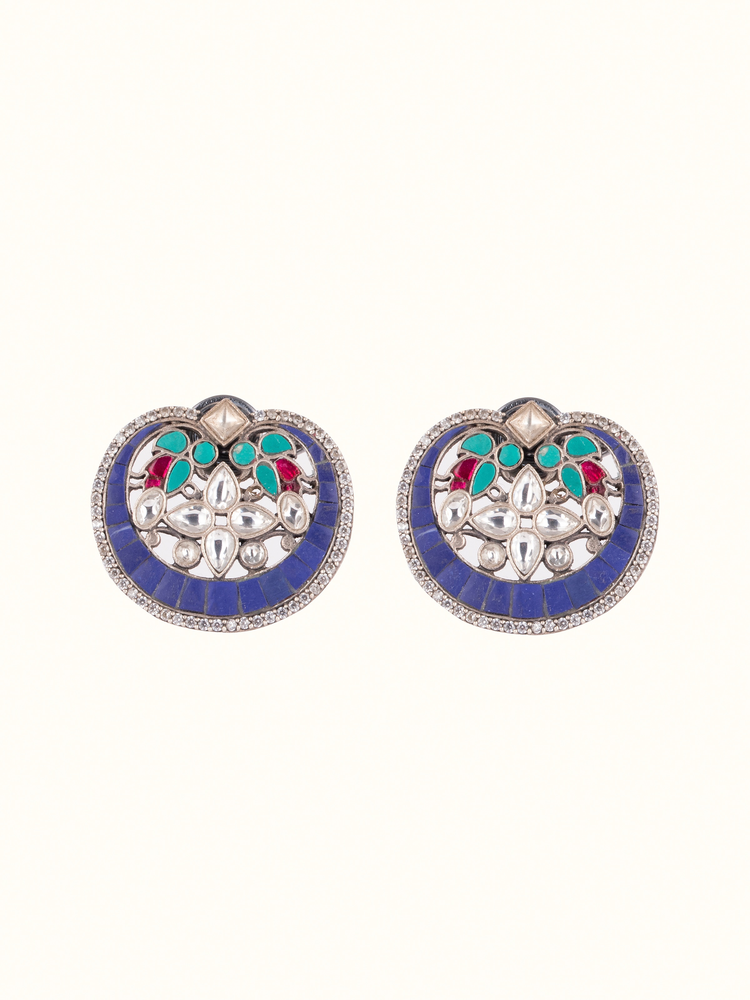 Front view of Smithing Stud Earrings showcasing intricate design and finish.