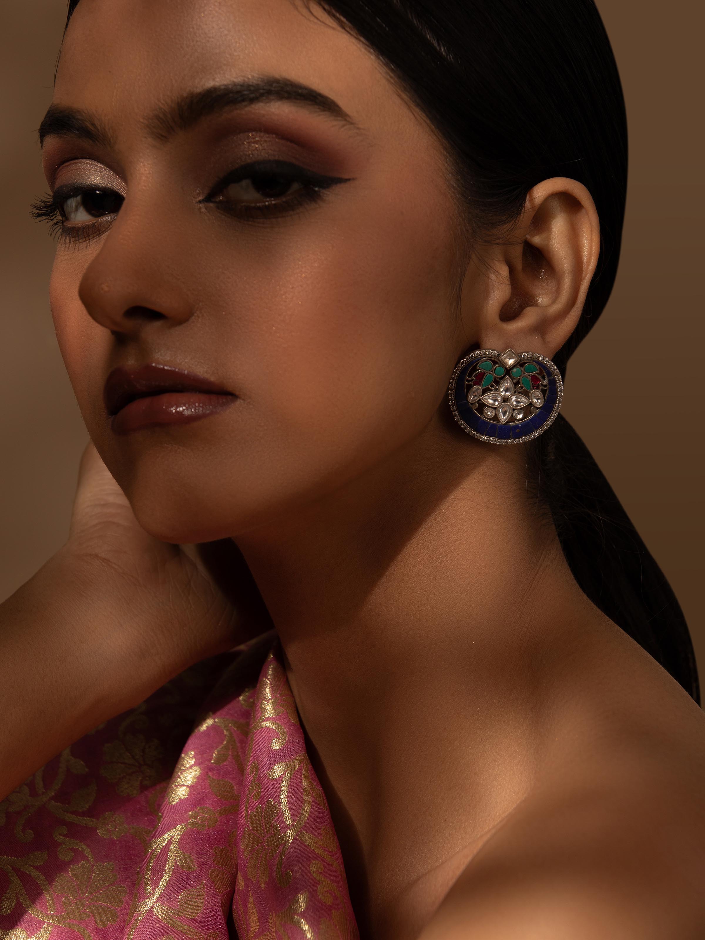 Close-up of Smithing Stud Earrings focusing on detailed craftsmanship.