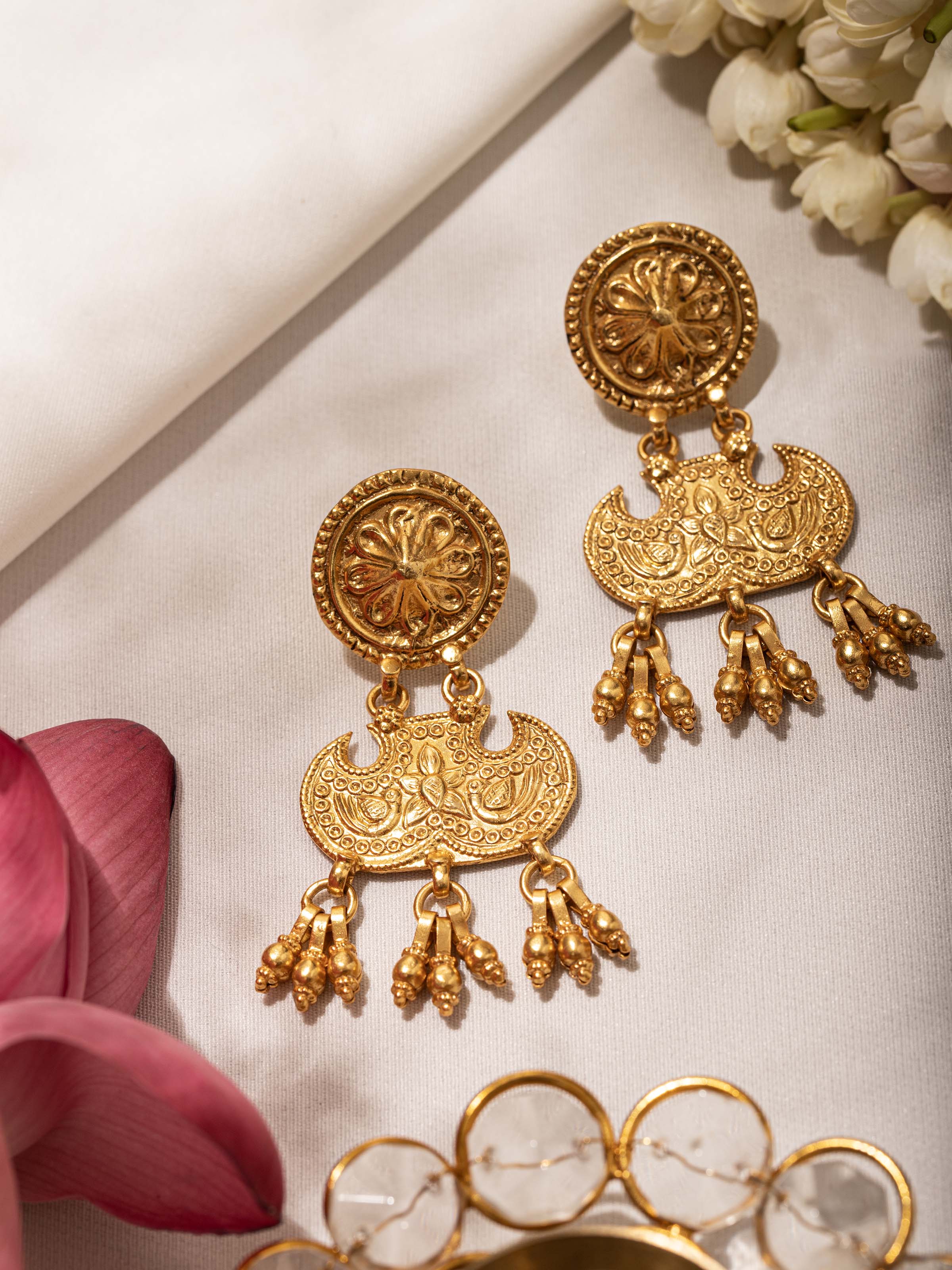 Angled view of Silver Smithing Drop Earrings emphasizing the elegant drop and intricate silver design by Swadesh