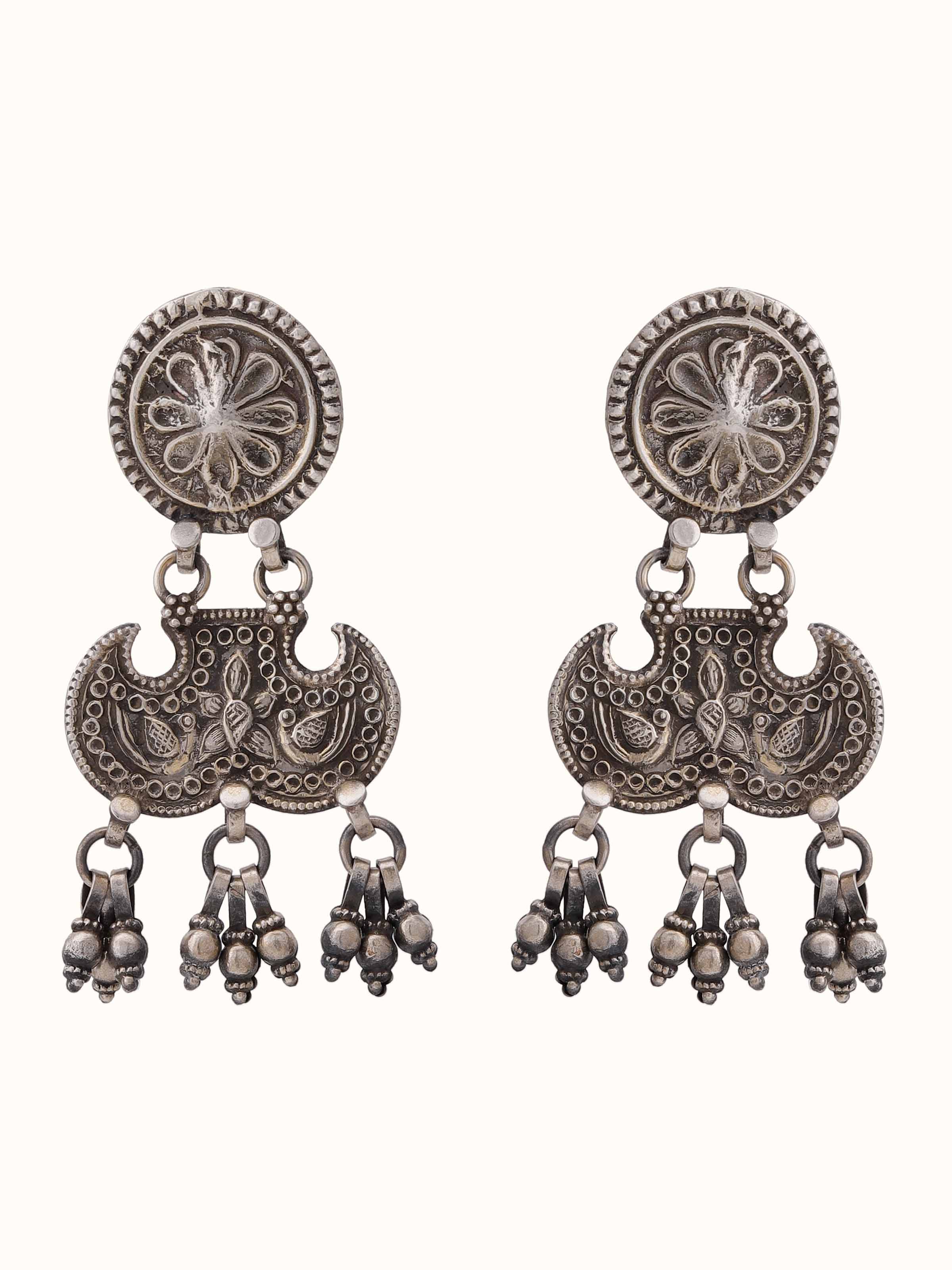 Overhead view of Smithing Drop Earrings showcasing sleek design and polished metalwork.