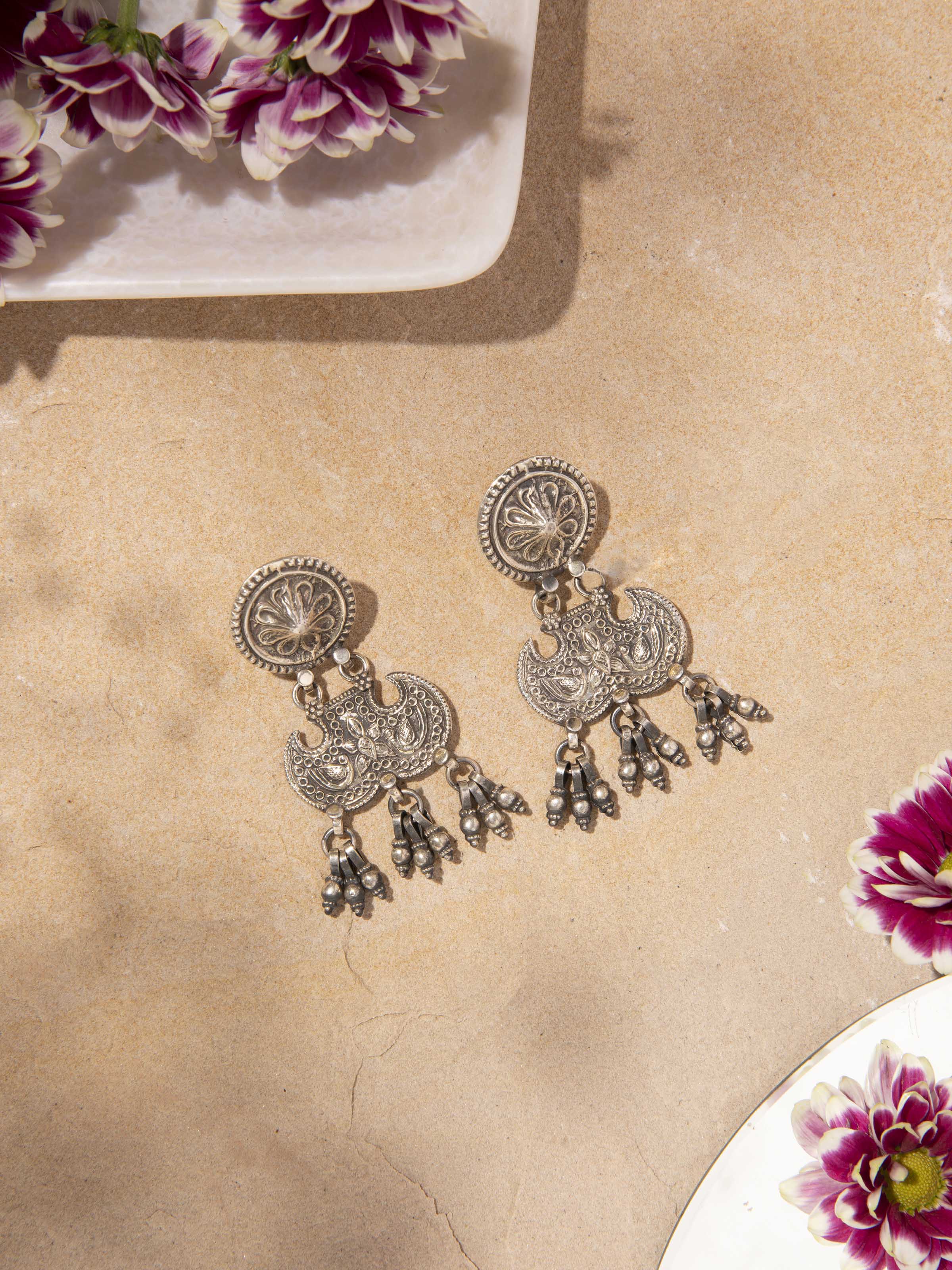 Side view of Smithing Drop Earrings displaying their modern design and high-quality metalwork.