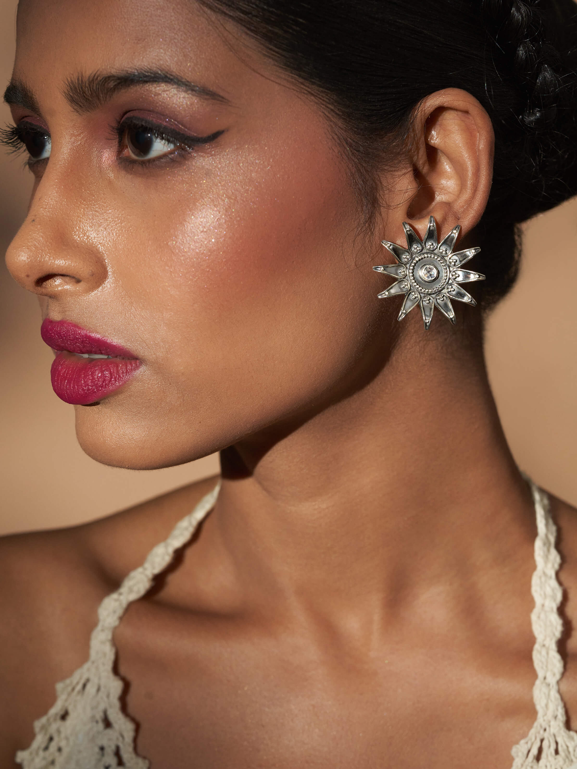 Side view of Silver Smithing Stud Earrings showcasing elegant design and fine silver craftsmanship.