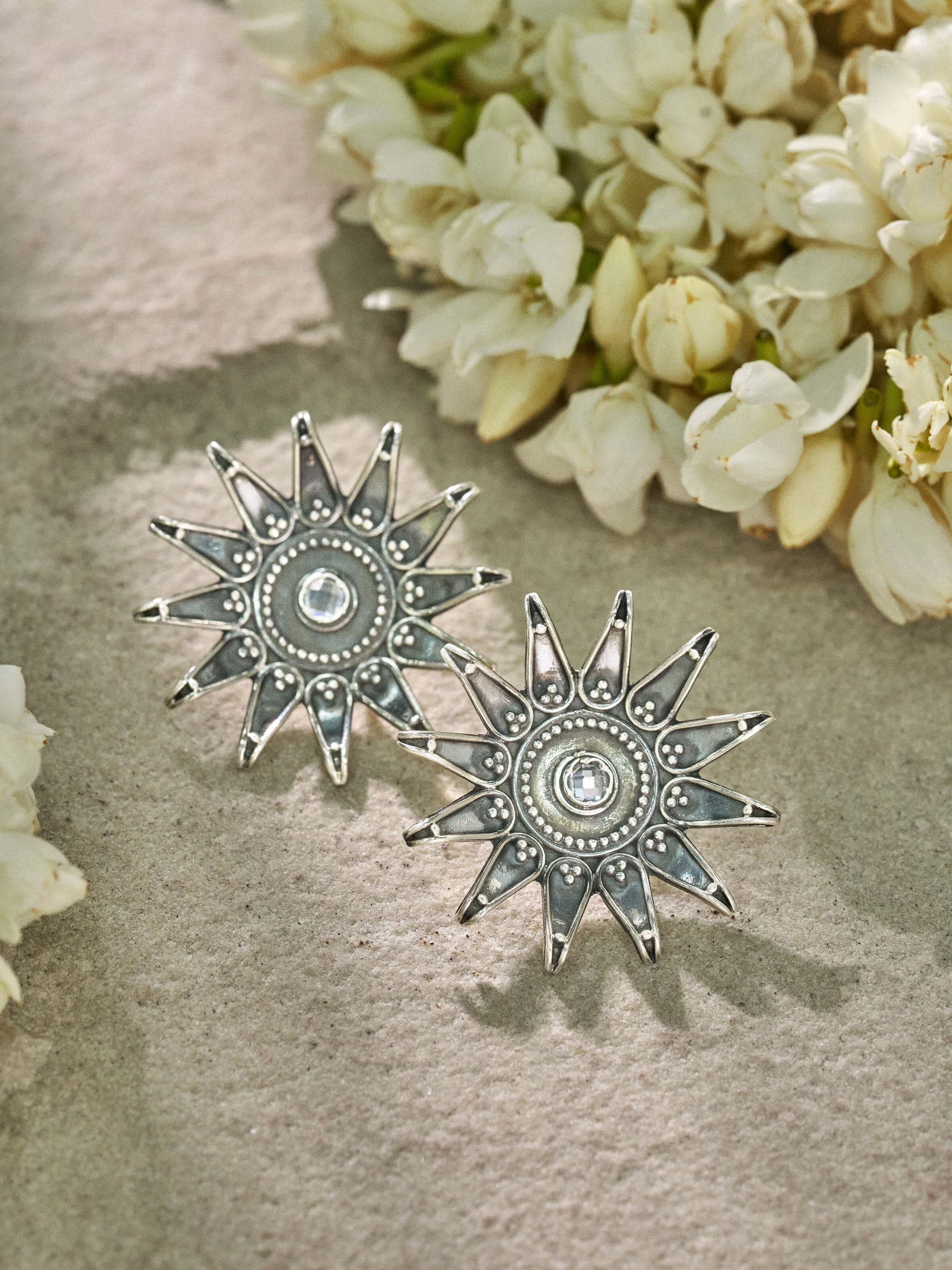 Close-up view of Silver Smithing Stud Earrings highlighting the intricate silver details and classic design.