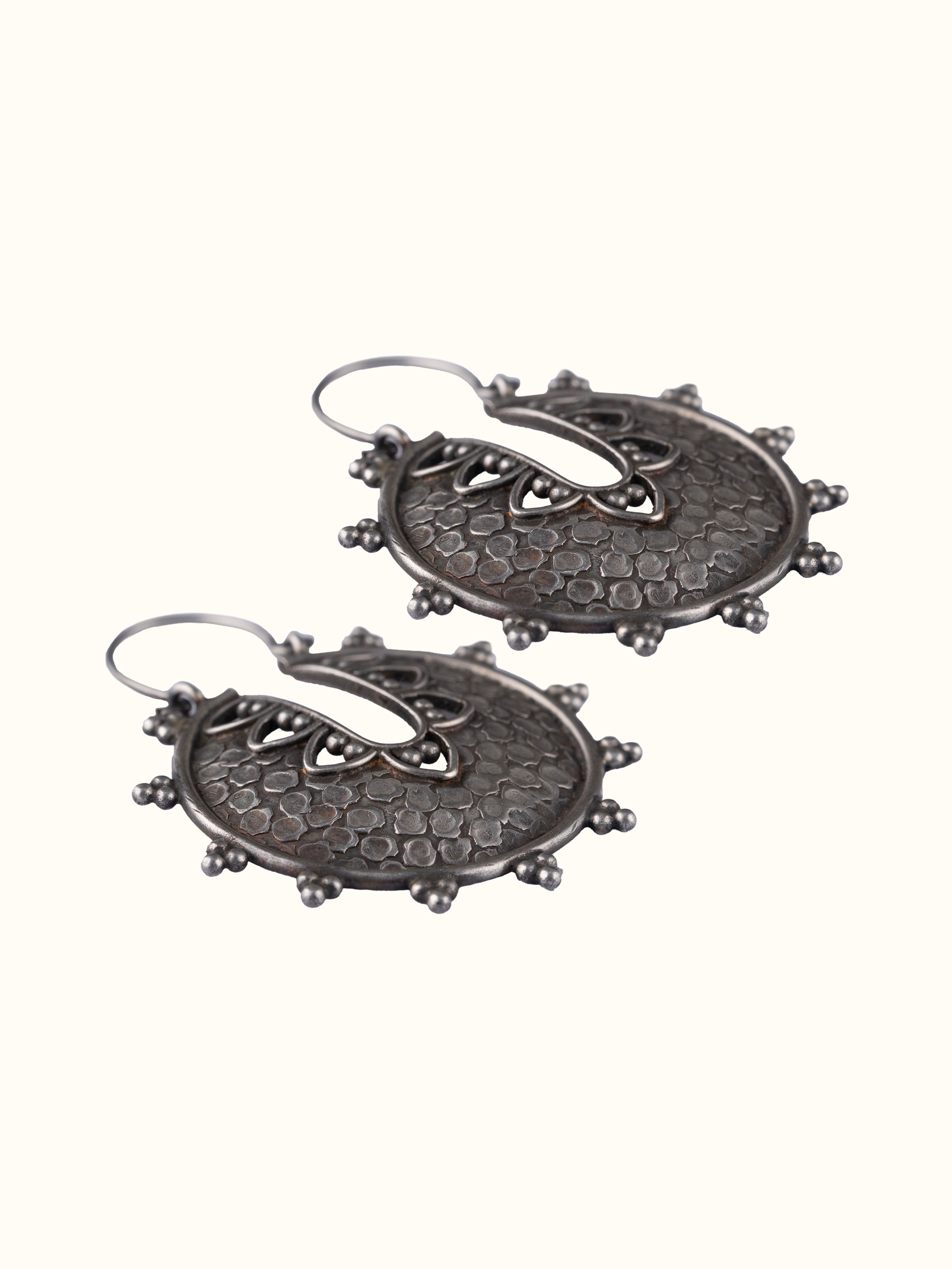 Artistic angle of Smithing Hoop Earrings showcasing their contemporary and elegant design.