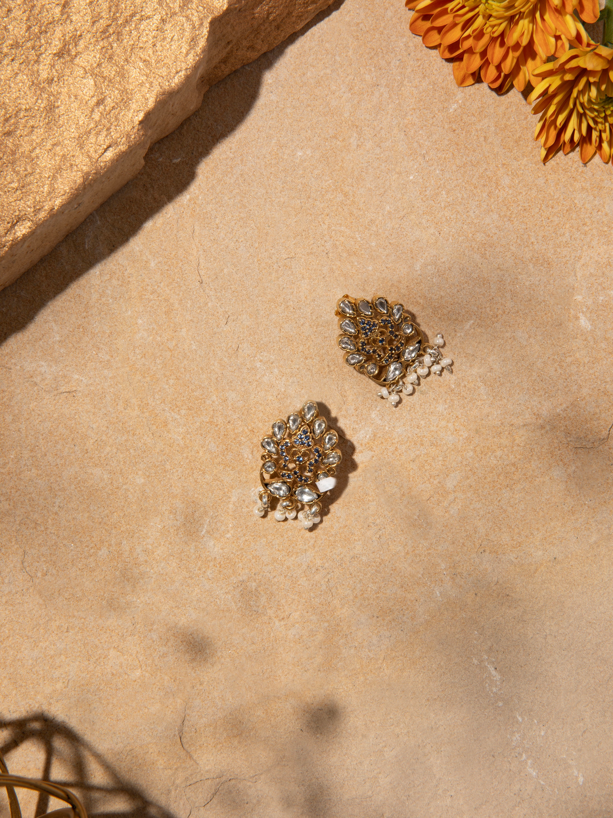 Side view of Silver Smithing Stud Earrings showcasing elegant metalwork.