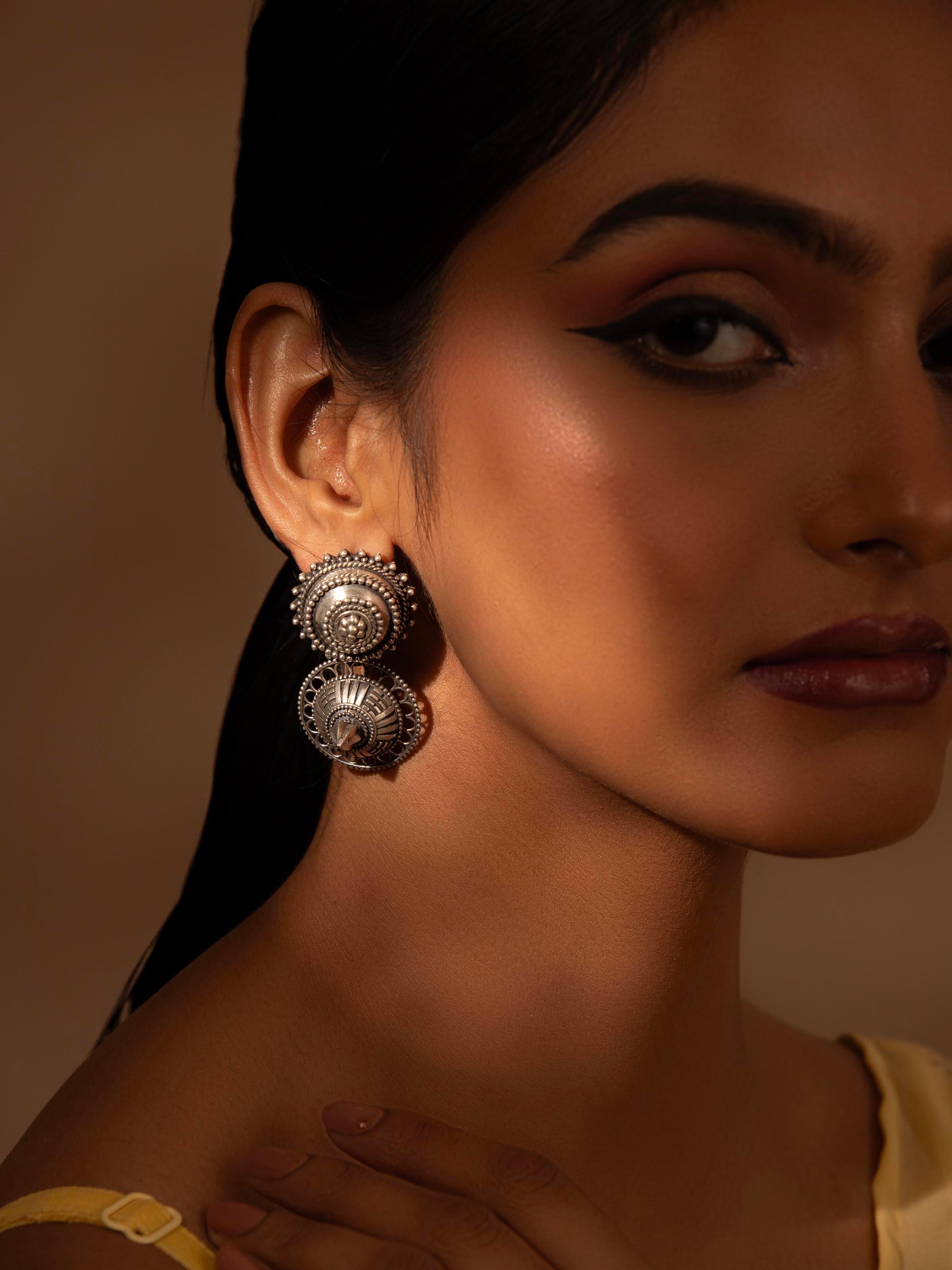 Side view of Silver Smithing Drop Earrings displaying the elegant drop design.