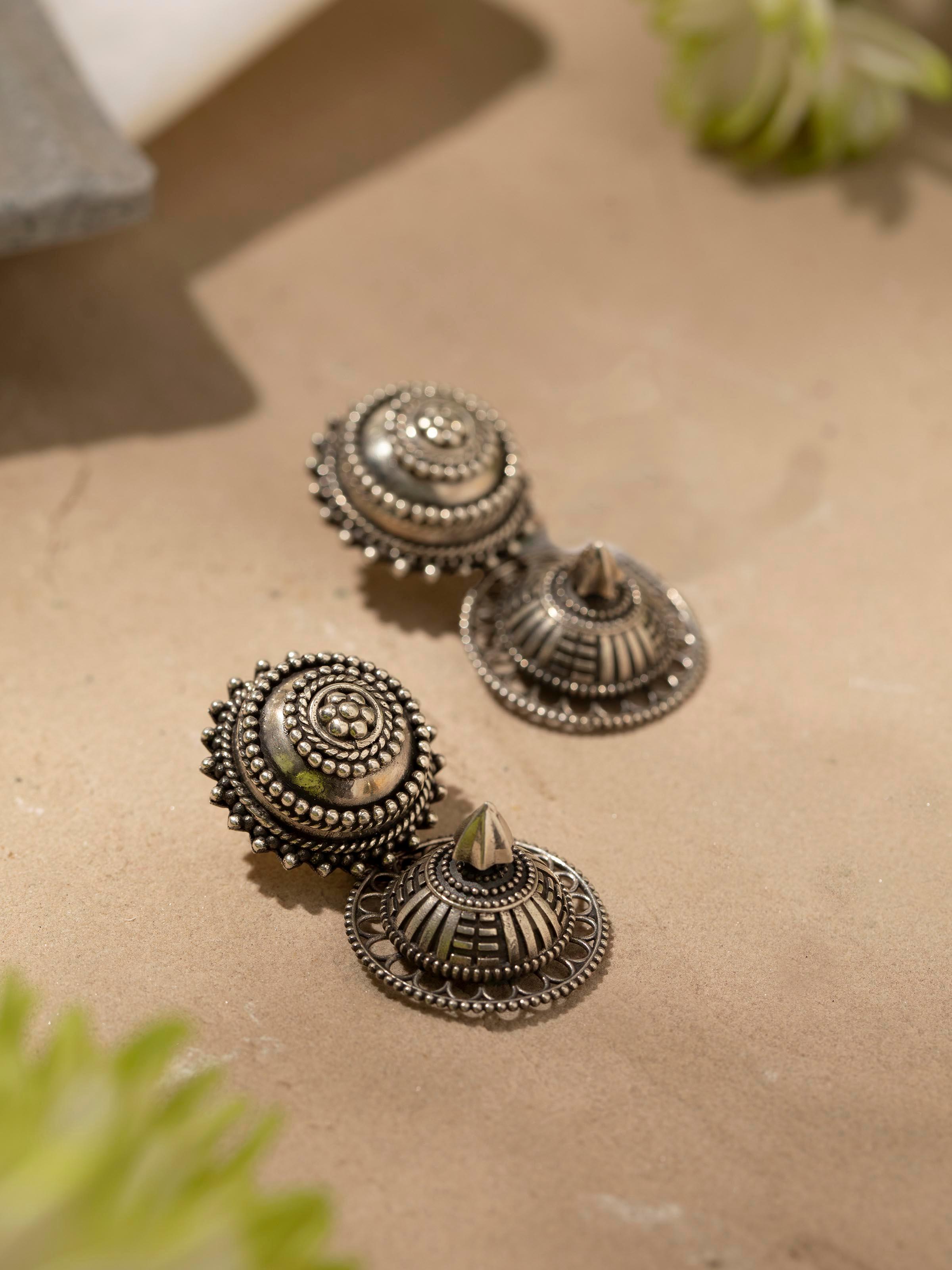 Detailed view of Silver Smithing Drop Earrings focusing on fine silverwork and design.