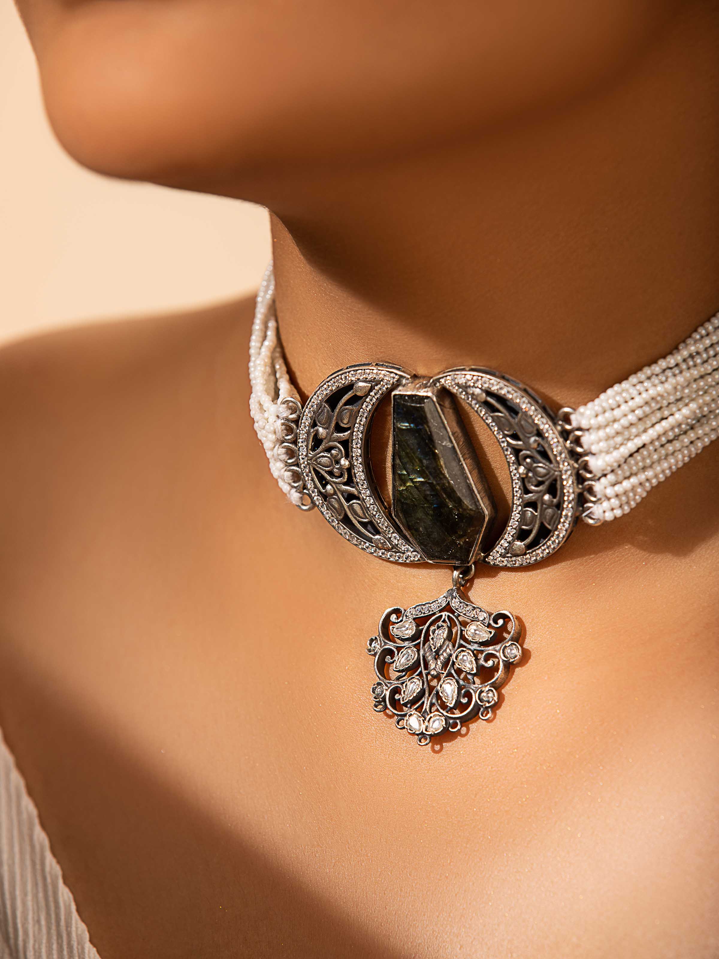 Side view of silver smithing choker showcasing its intricate design and elegant craftsmanship.