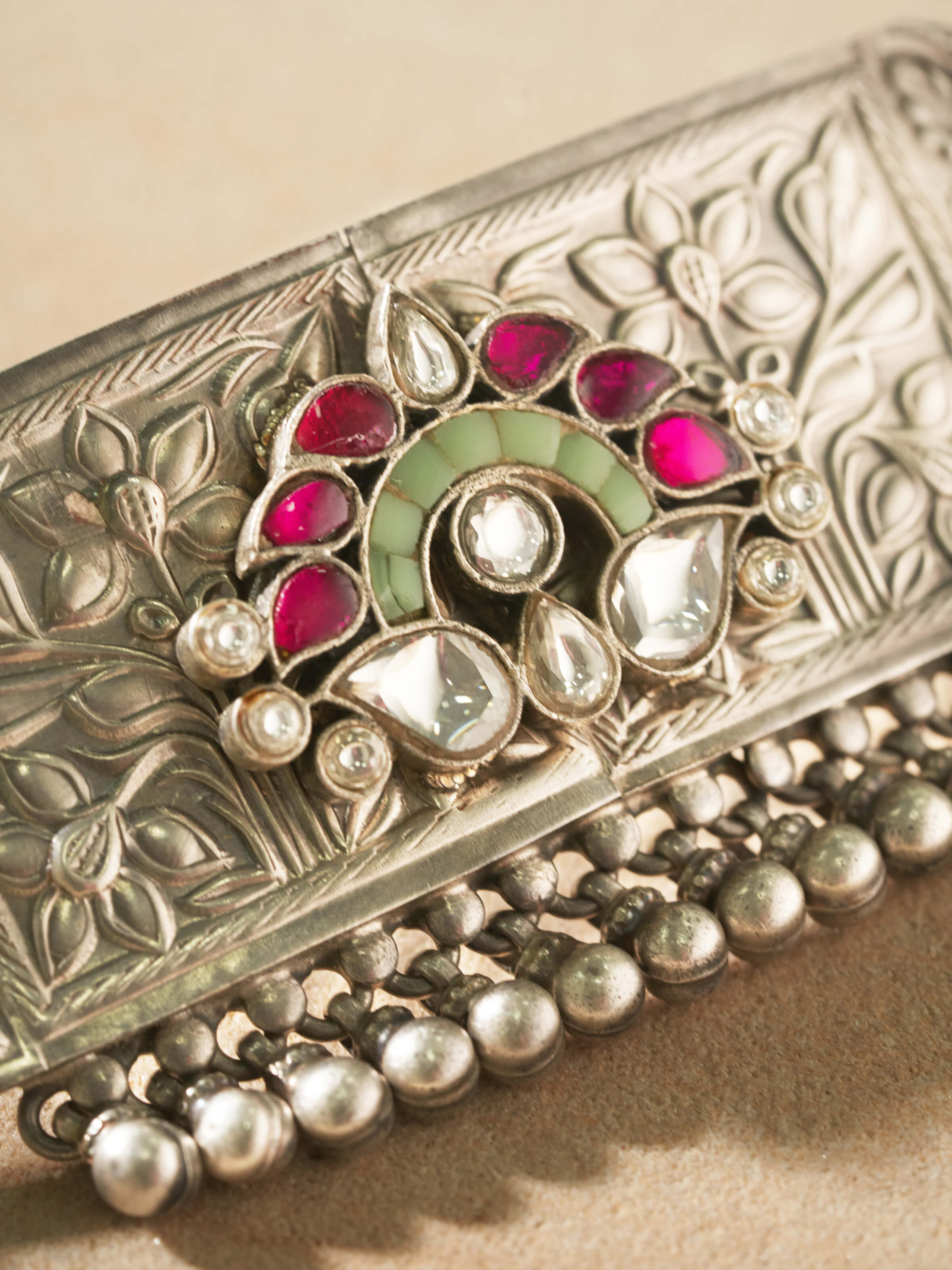 Angled view of Silver Smithing Choker showcasing its detailed craftsmanship and silver finish.