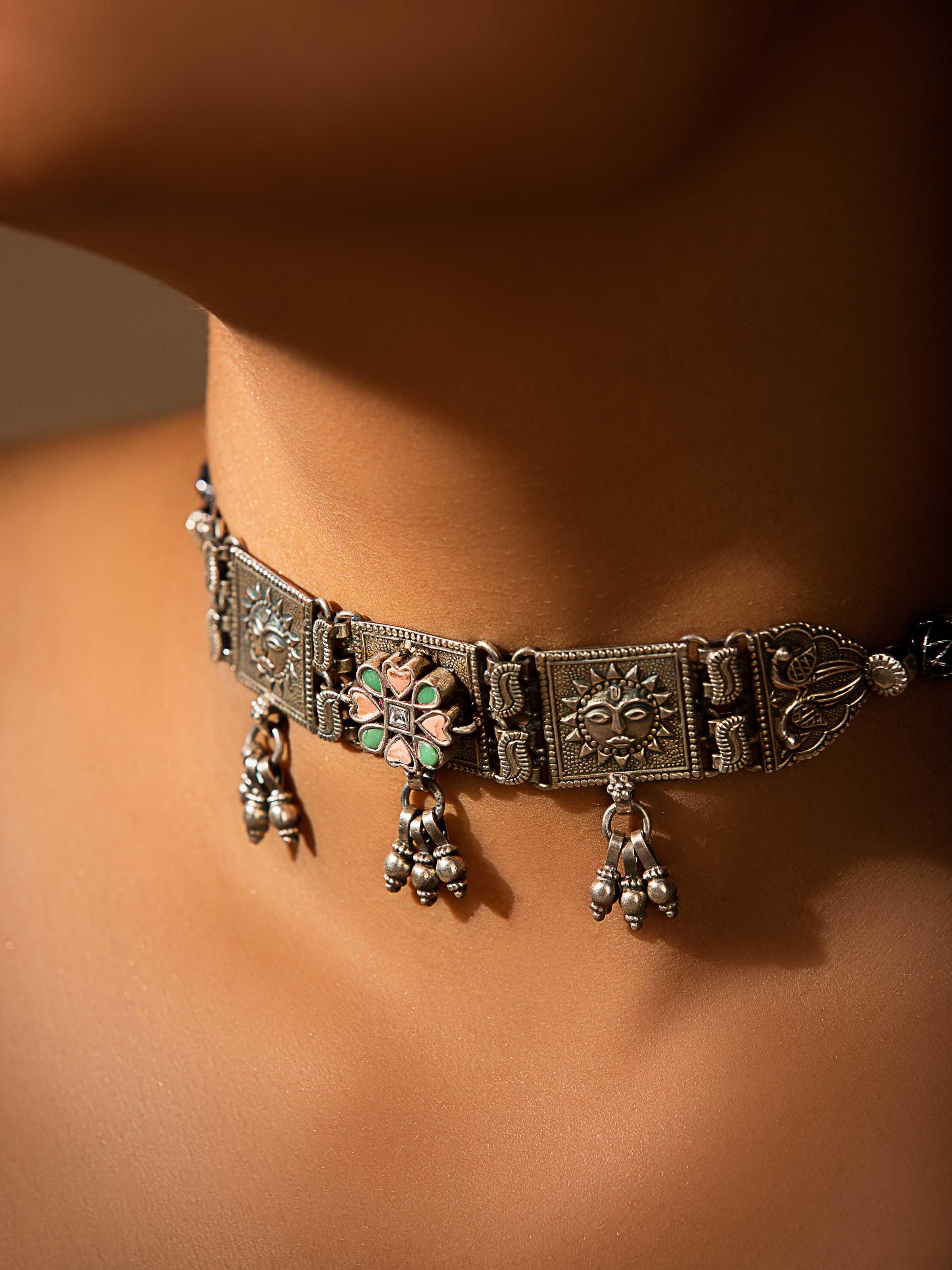 Side view of Silver Smithing Choker highlighting its contour and silver details.