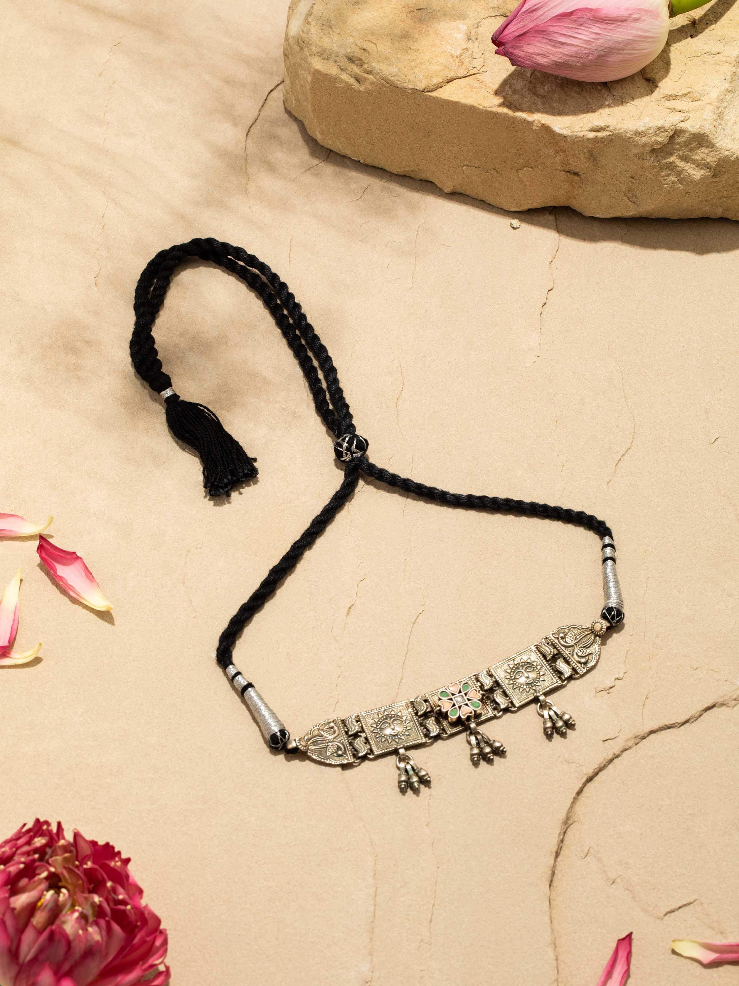 Angled view of Silver Smithing Choker displaying its sleek design and detailed craftsmanship.