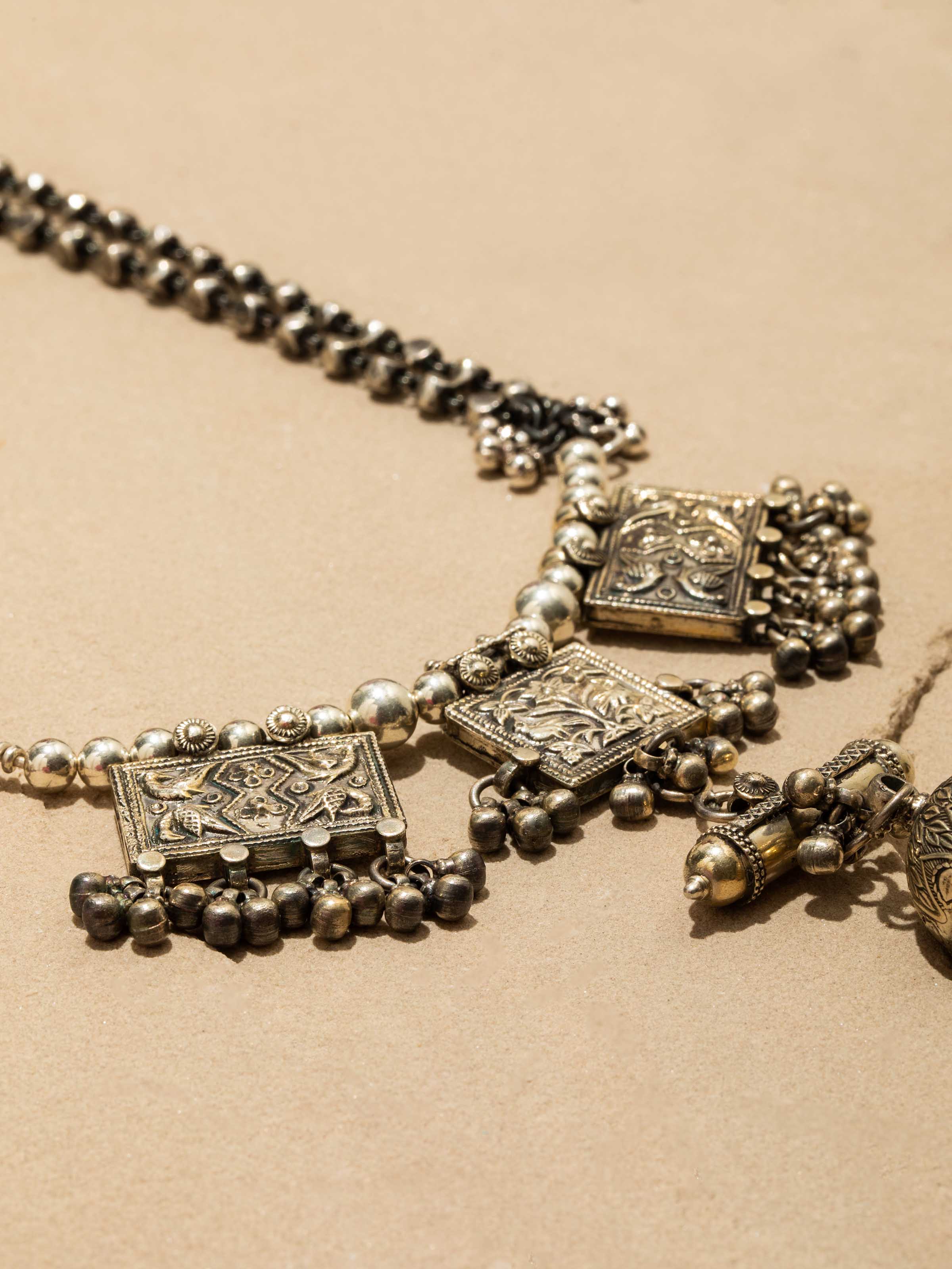 Close-up of Silver Smithing Long Necklace featuring detailed artistry by Swadesh