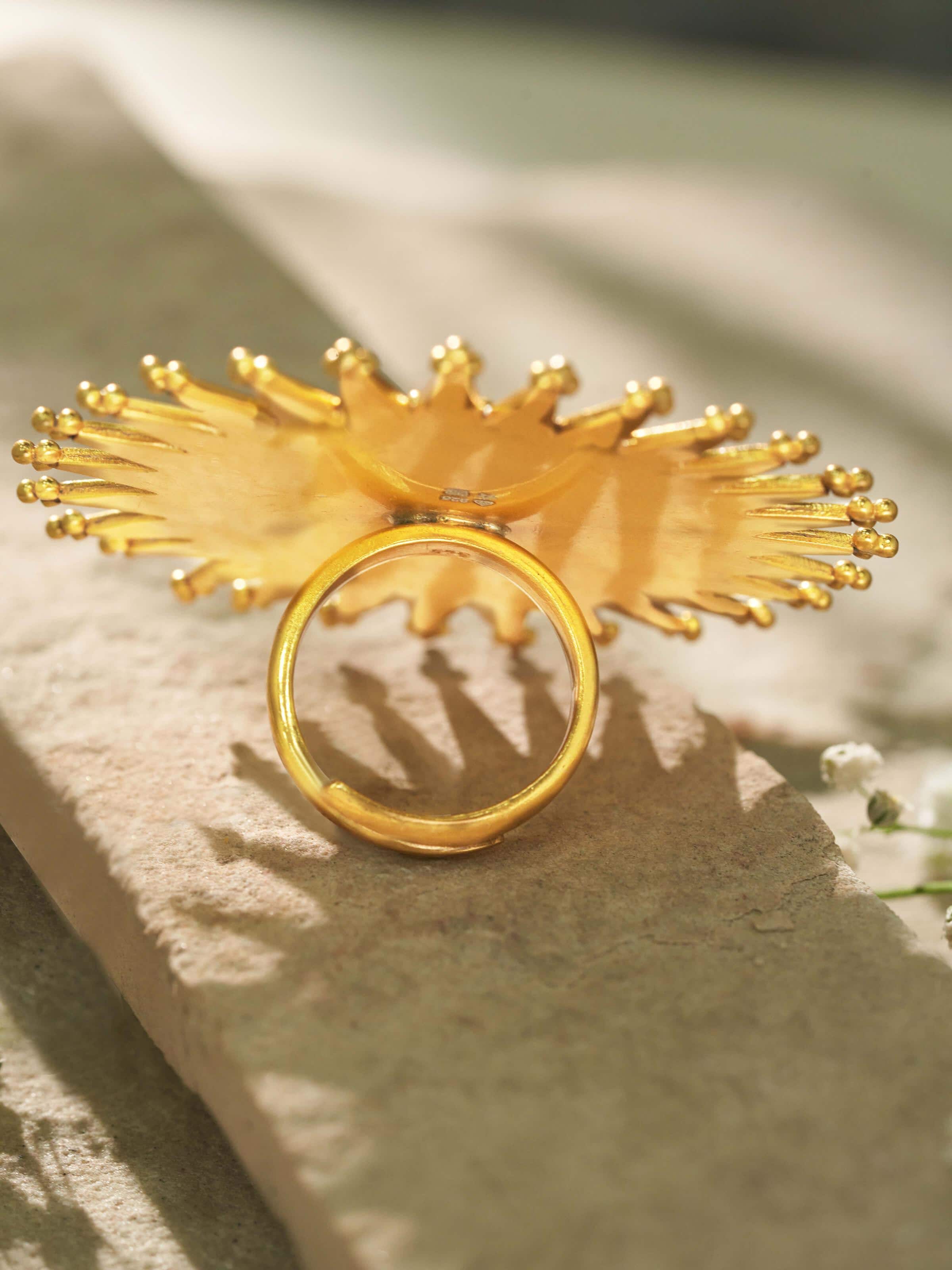 Back view of silver smithing ring presenting its seamless structure and handcrafted form