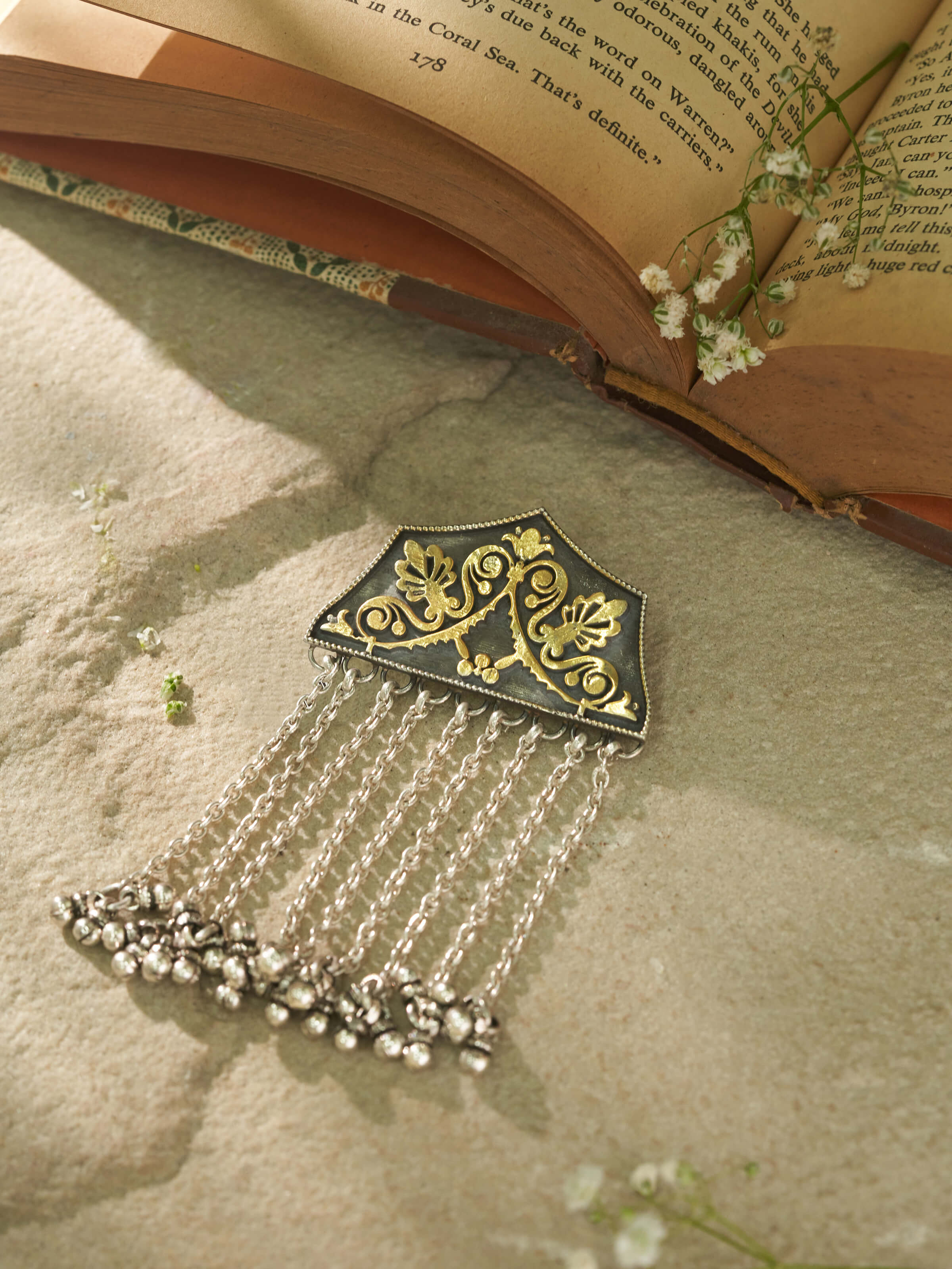 Close-up view of Silver Smithing Pendant showcasing intricate silver detailing and elegant design.