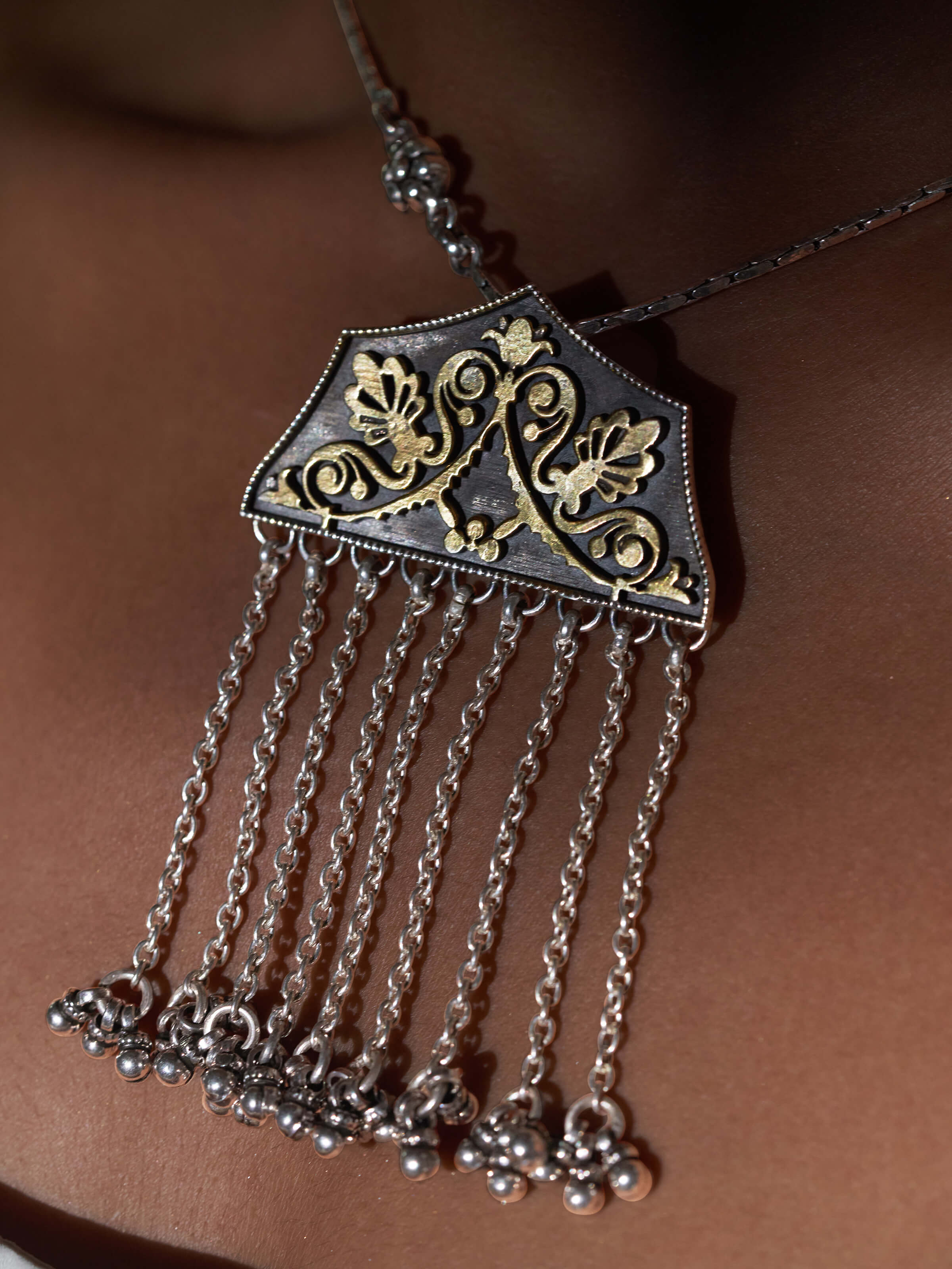 Overhead view of Silver Smithing Pendant featuring elegant design and intricate metal detailing.