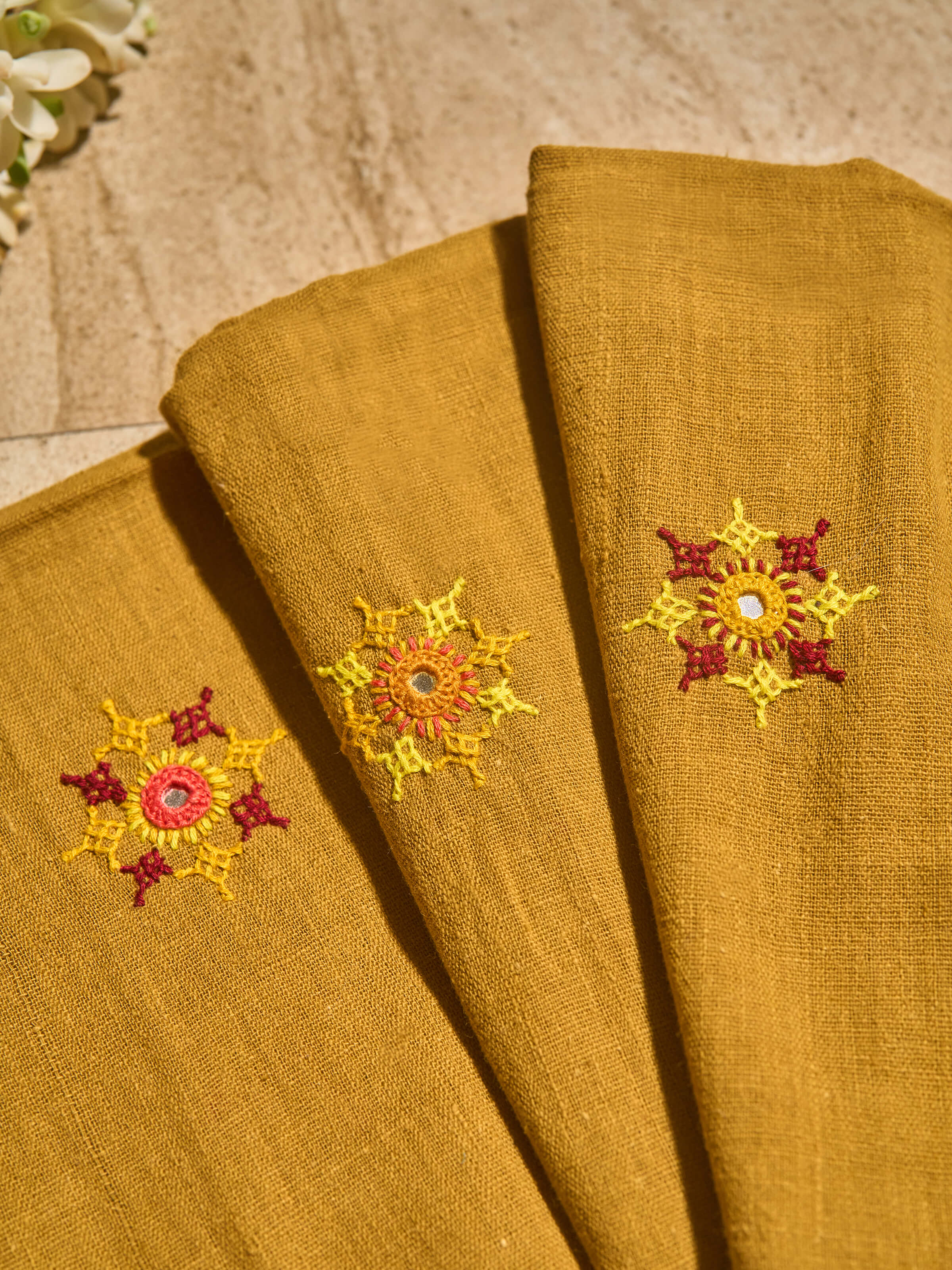 Detailed shot of the vibrant, colorful embroidery work.