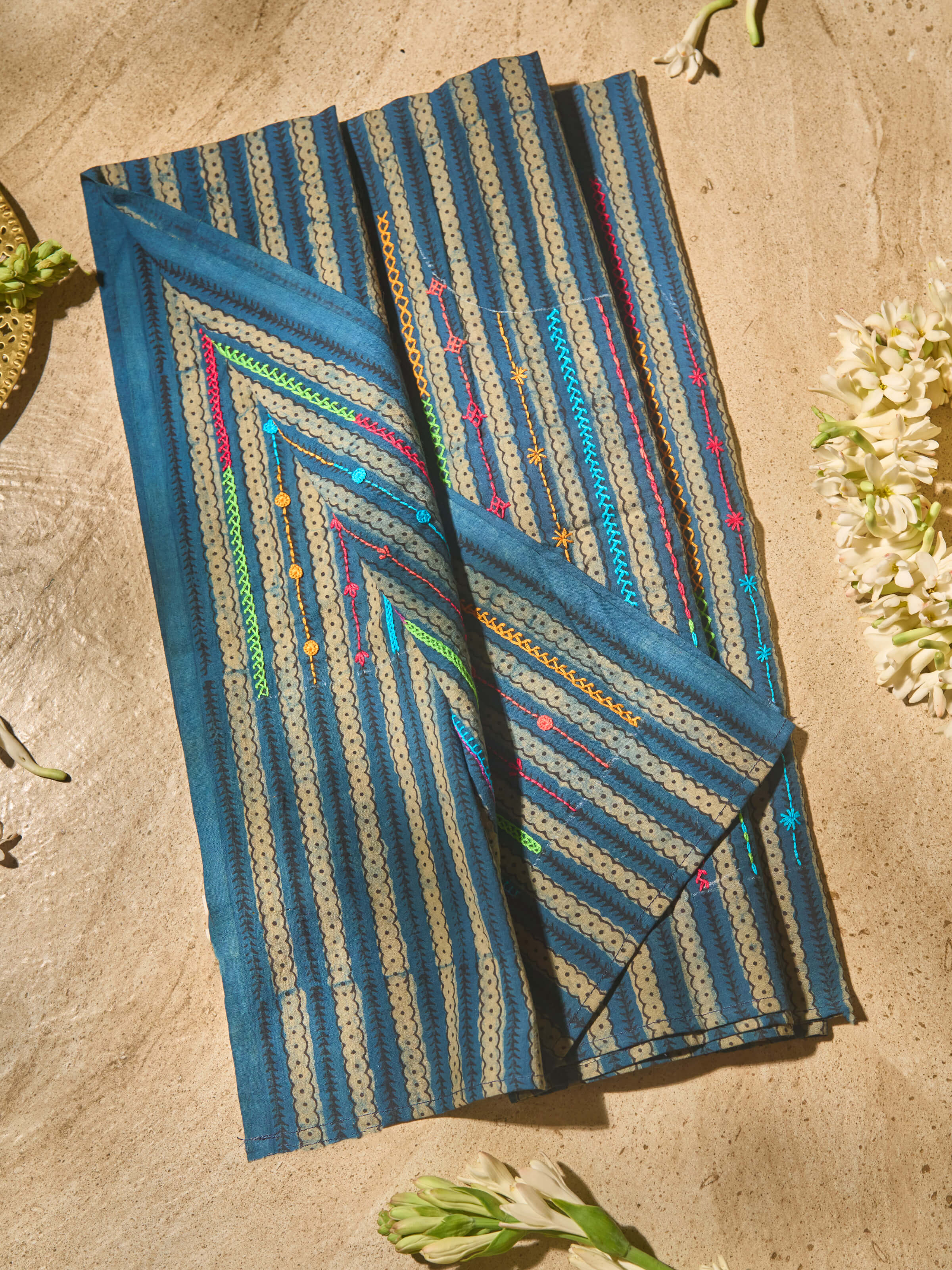 Lifestyle view of Blue & Beige Cotton Lambani Embroidered Blouse Piece showcasing embroidery patterns on cotton fabric