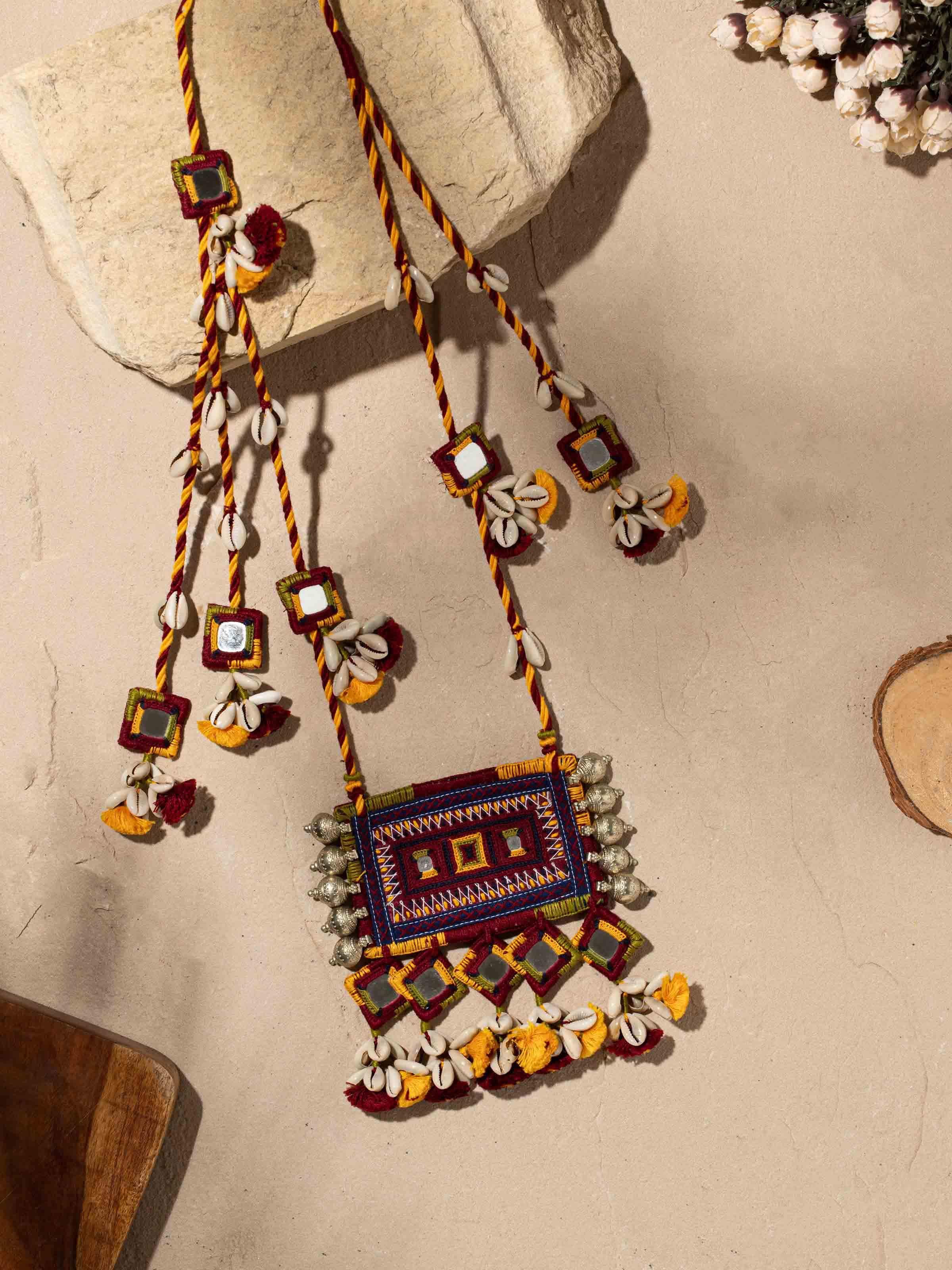 Side view of Banjara embroidery long necklace showing detailed hand-stitched patterns