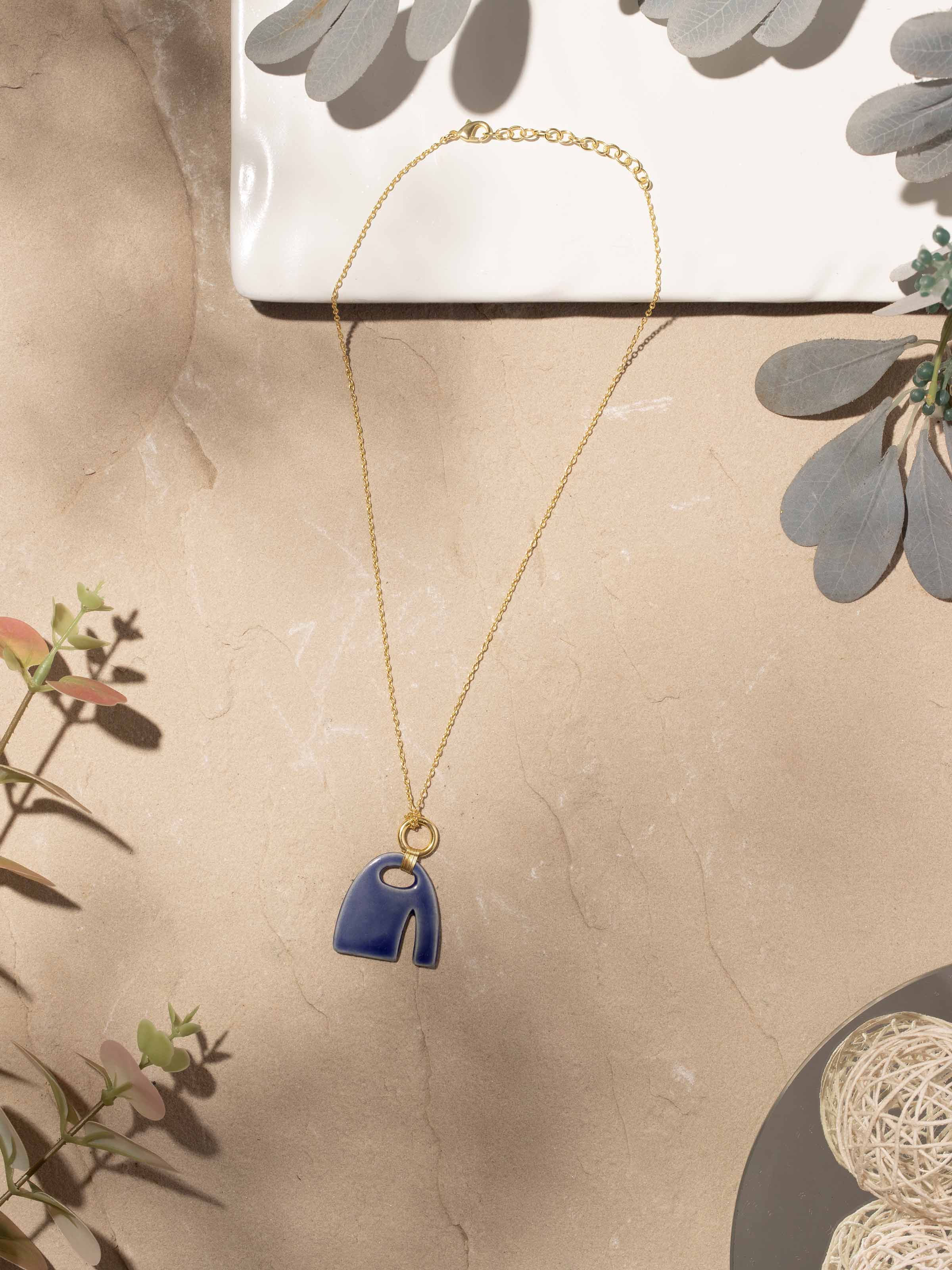 Close-up view of Beads & Brass Bells Collar Necklace focusing on the craftsmanship of the brass bells and beads.