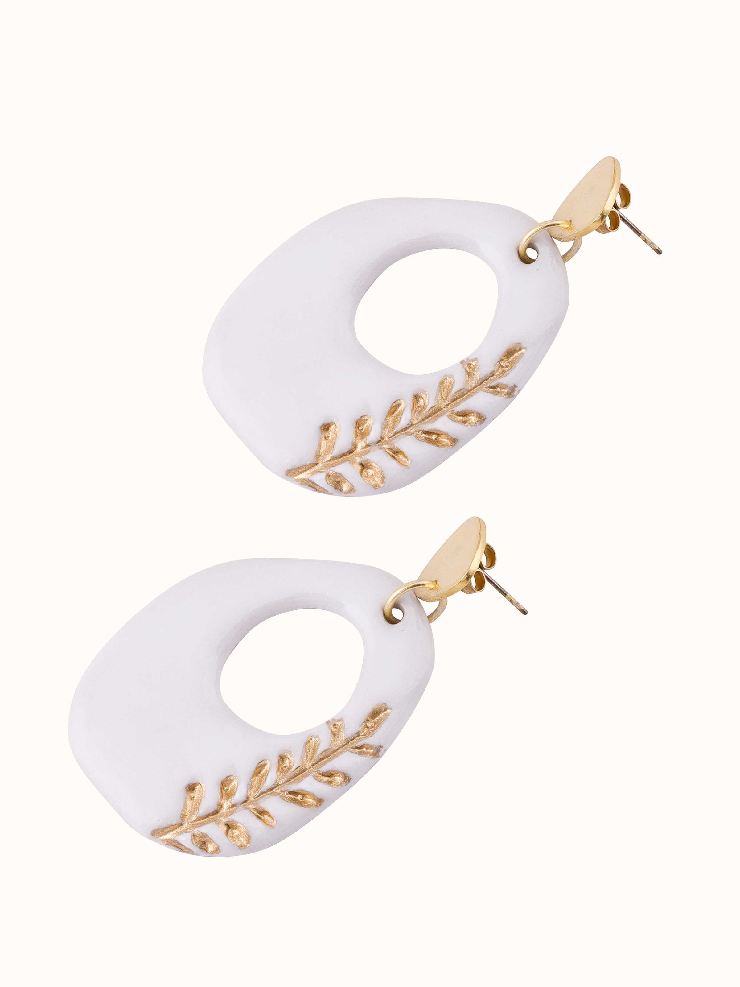 Overhead view of Ceramic Drop Earrings focusing on the detailed ceramic art