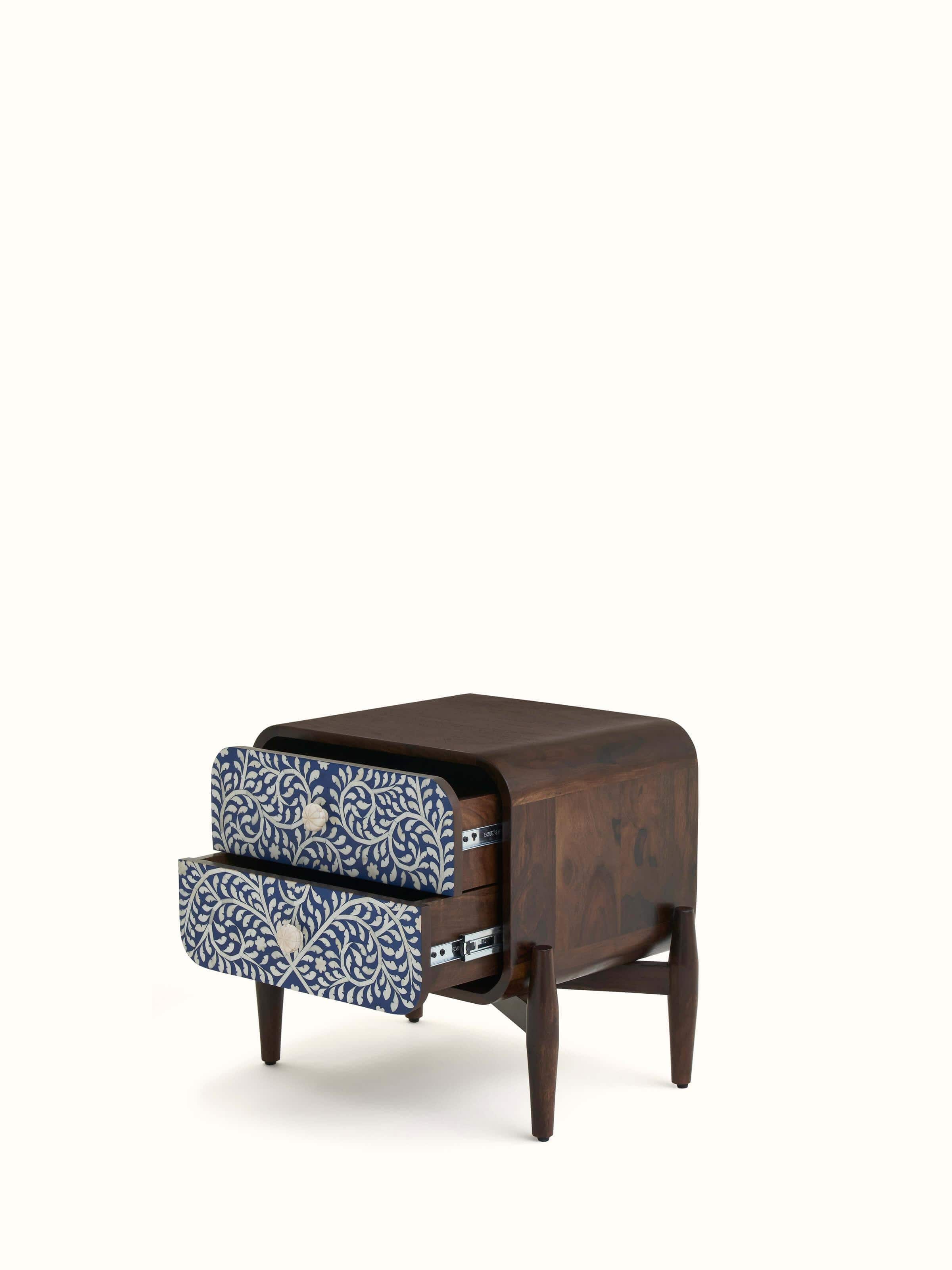 Close-up of the painted designs on the portable table, highlighting the vibrant colors and fine details.