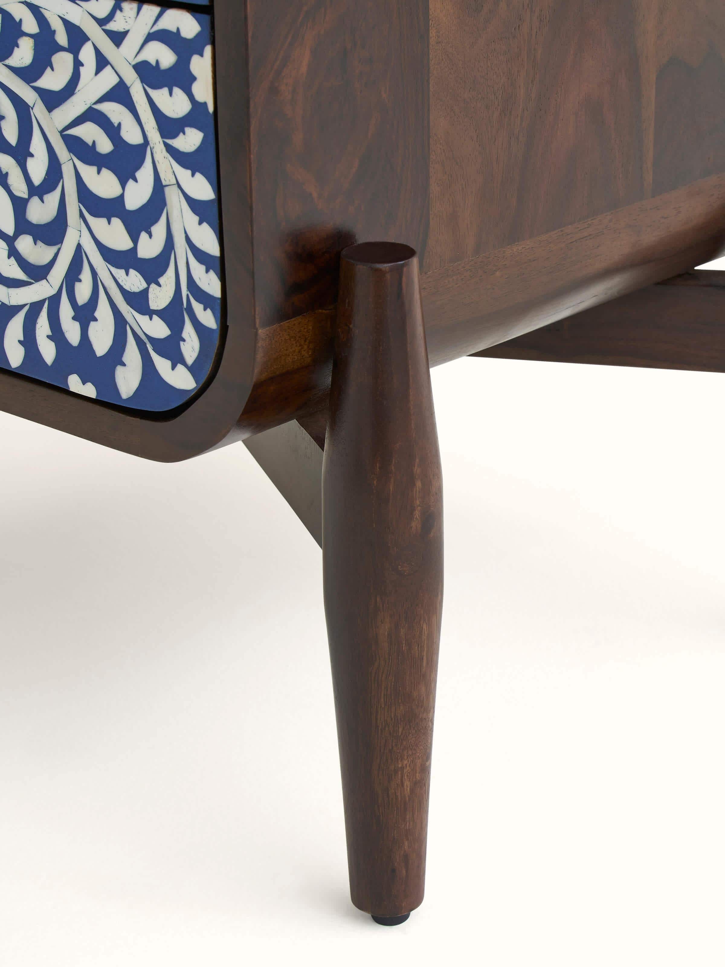 Side profile of the miniature painted table, emphasizing its compact, portable design and artistic finish.