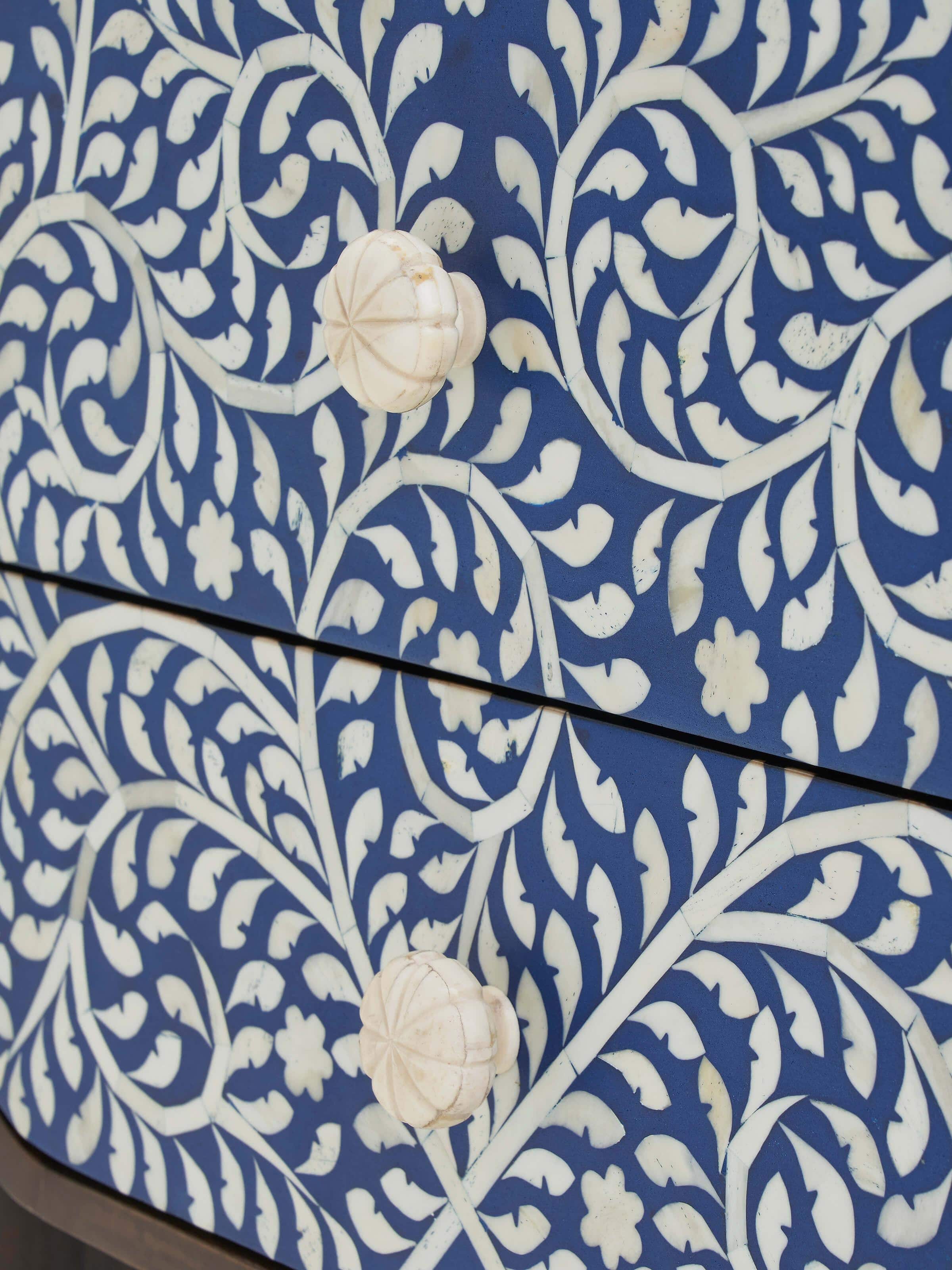 Detailed view of the table's painted surface and edge, showcasing the craftsmanship and design.