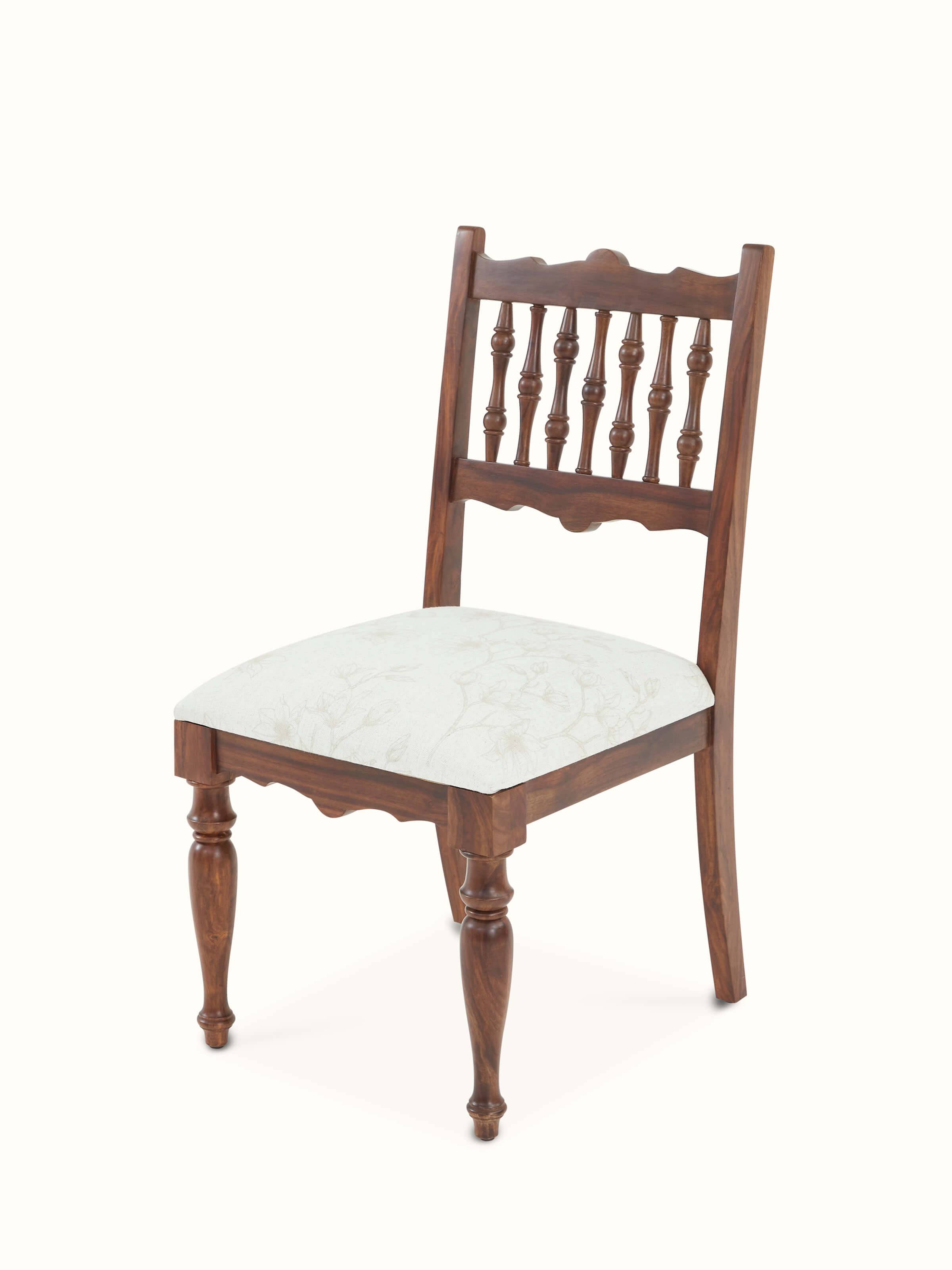 Angled view of upholstered Sheesham wood dining chair, emphasizing elegant lines and plush seating.