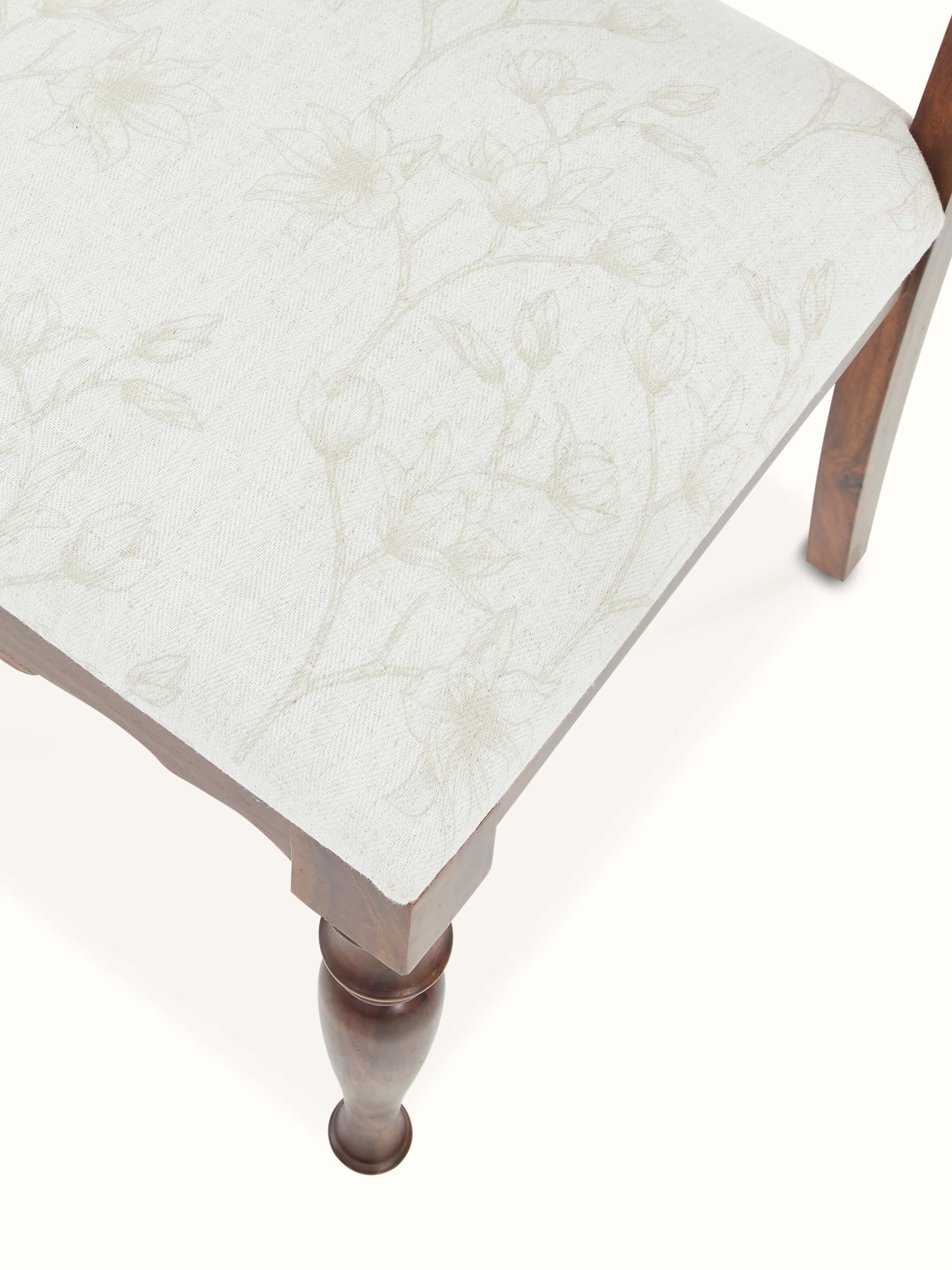 Close-up of the upholstered seat of Sheesham wood dining chair, showcasing fine fabric and detailed finish.