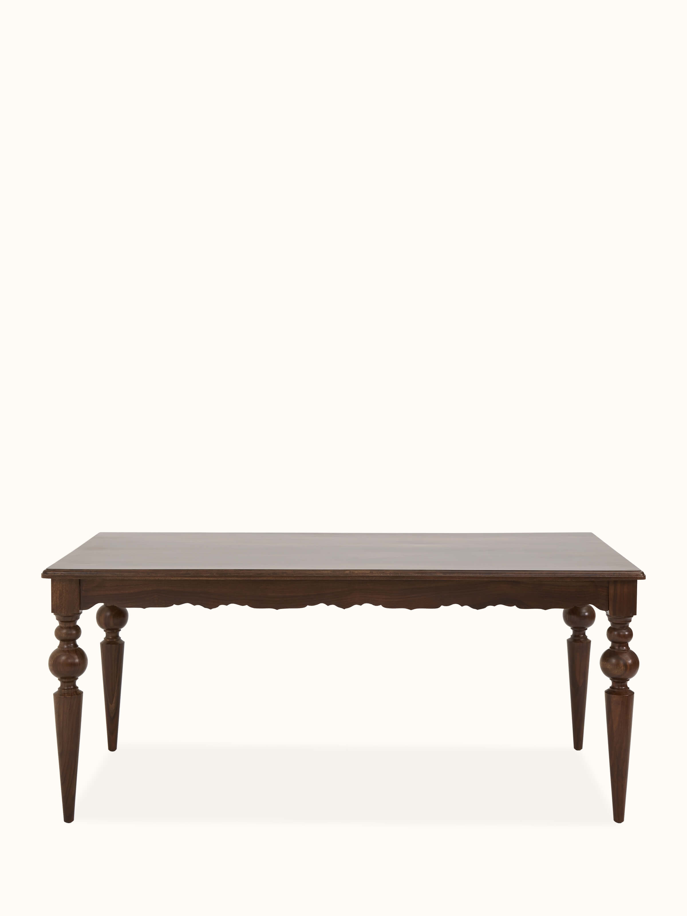 Front view of teak finish Sheesham wood 6-seater dining table, highlighting the smooth surface and rich finish.