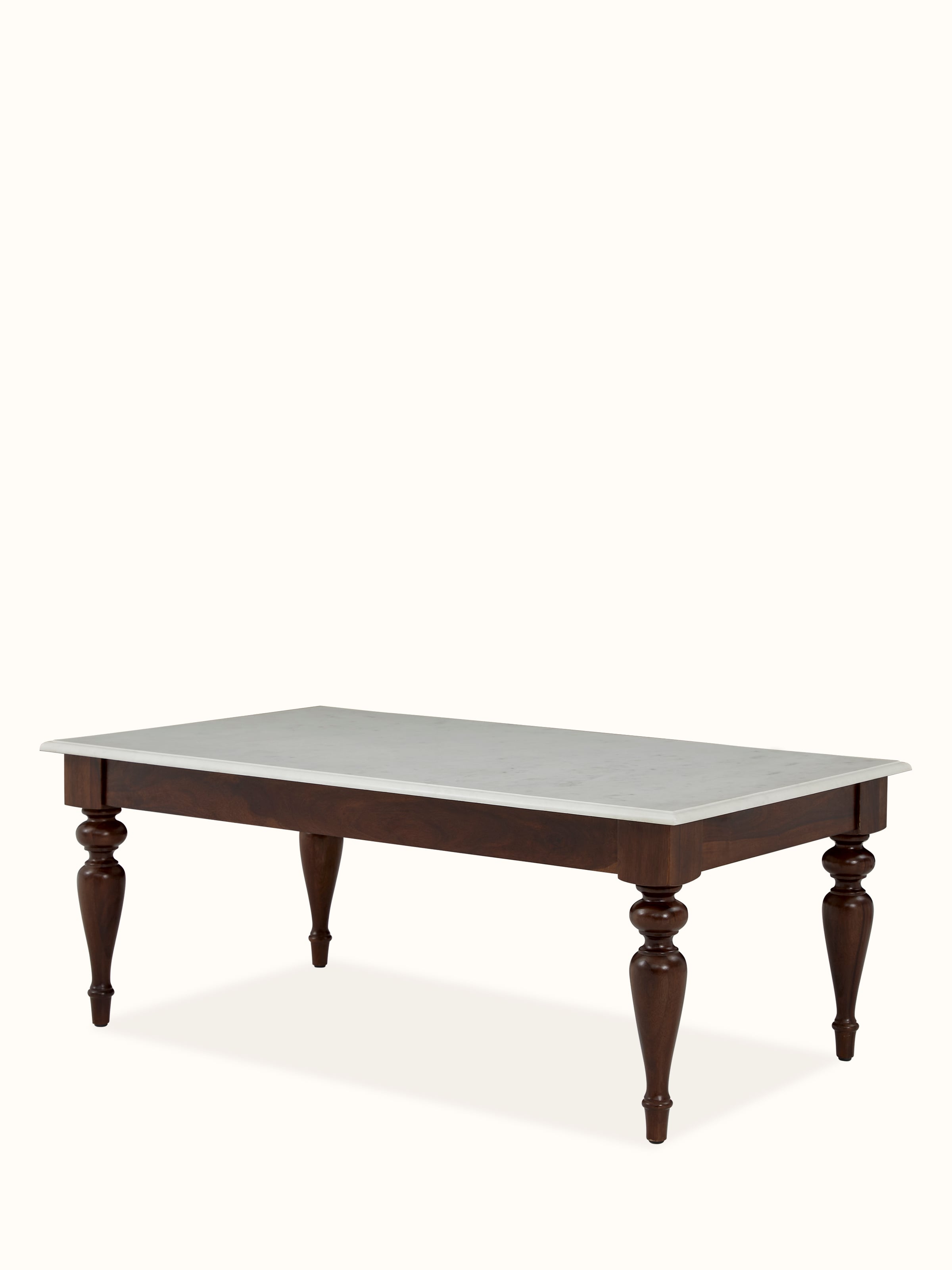 Angled view of Sheesham wood & marble coffee table, emphasizing the sleek design and elegant craftsmanship.