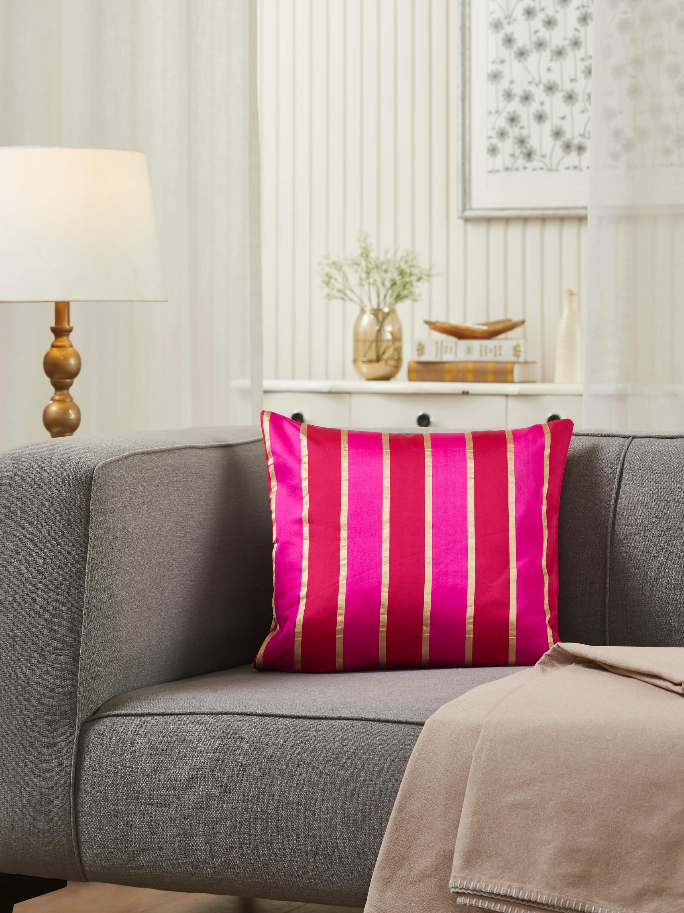 Close-up view of Aarcha raspberry stripe silk brocade Banarasi handloom cushion cover, highlighting the intricate details.