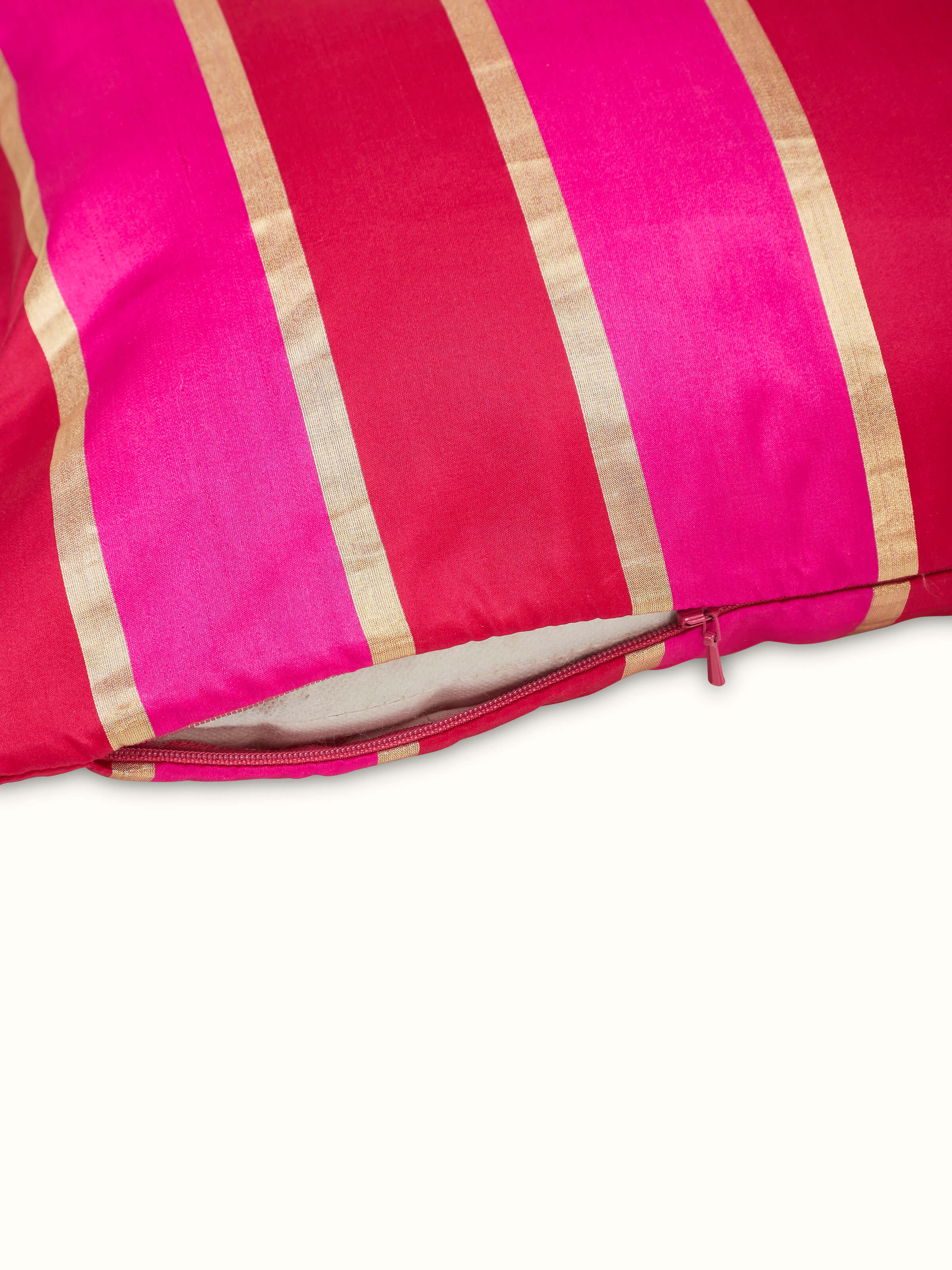Detailed view of the Aarcha Raspberry Stripe Silk Brocade Banarasi Handloom Lumbar Cushion Cover, highlighting the fabric texture and color.
