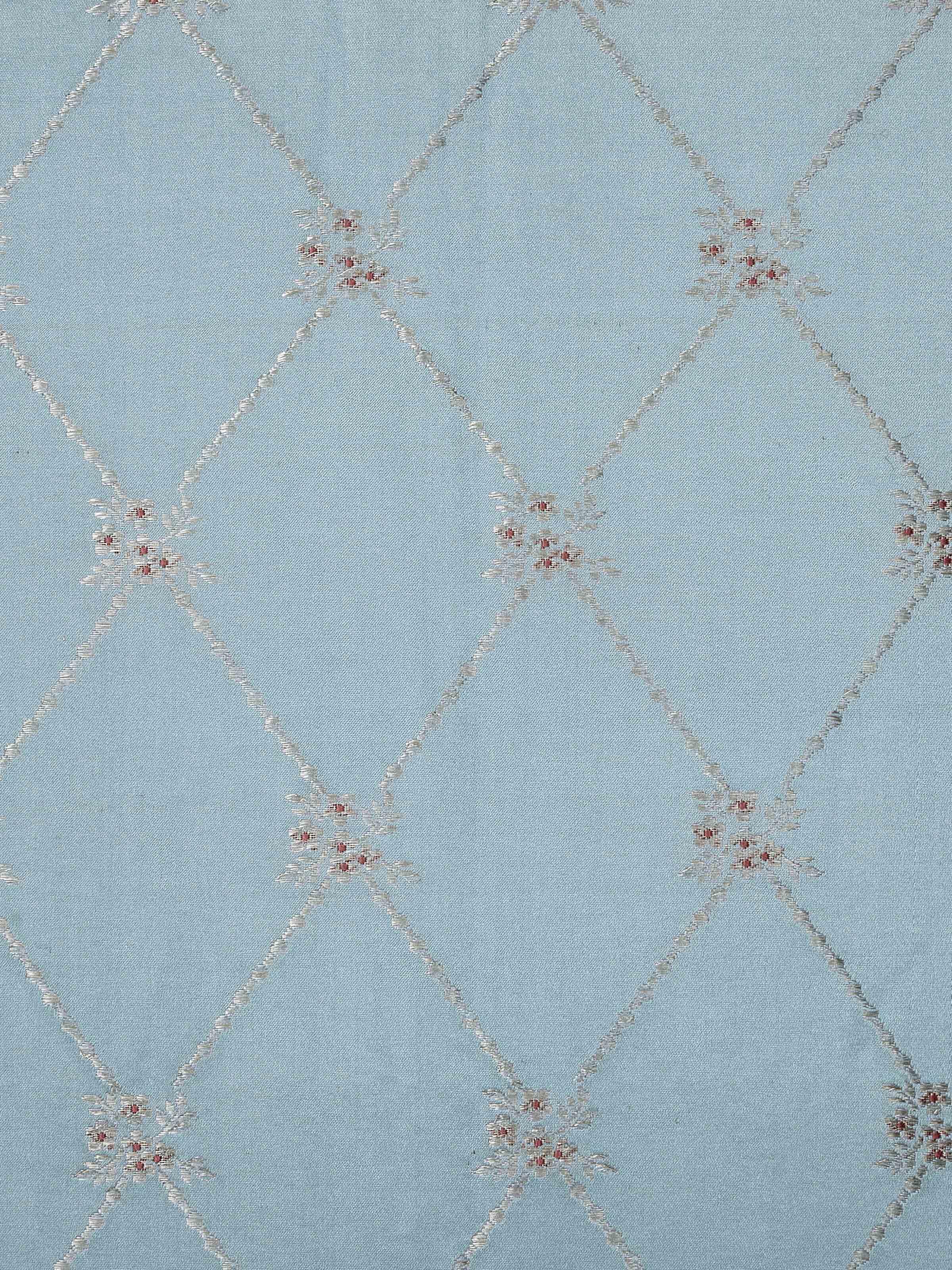 Detail shot 3: Detailed corner showing quality finish and intricate woven motif on brocade cushion.