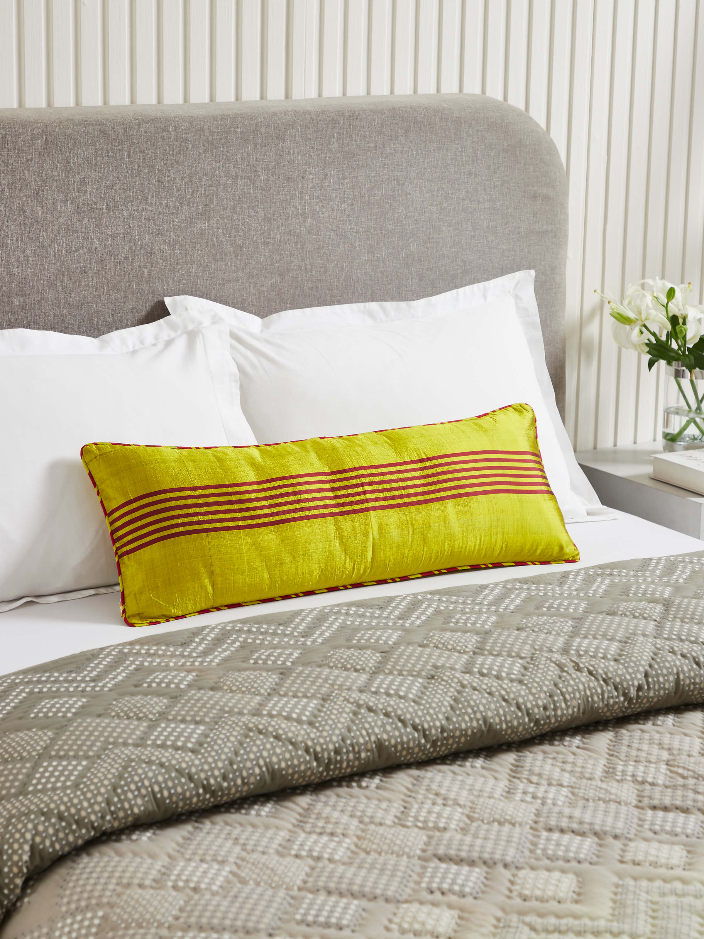 Close-up of Bhoomi Yellow Stripe Silk Odisha Ikat Handloom Cushion Cover, showcasing the detailed texture and weaving pattern.