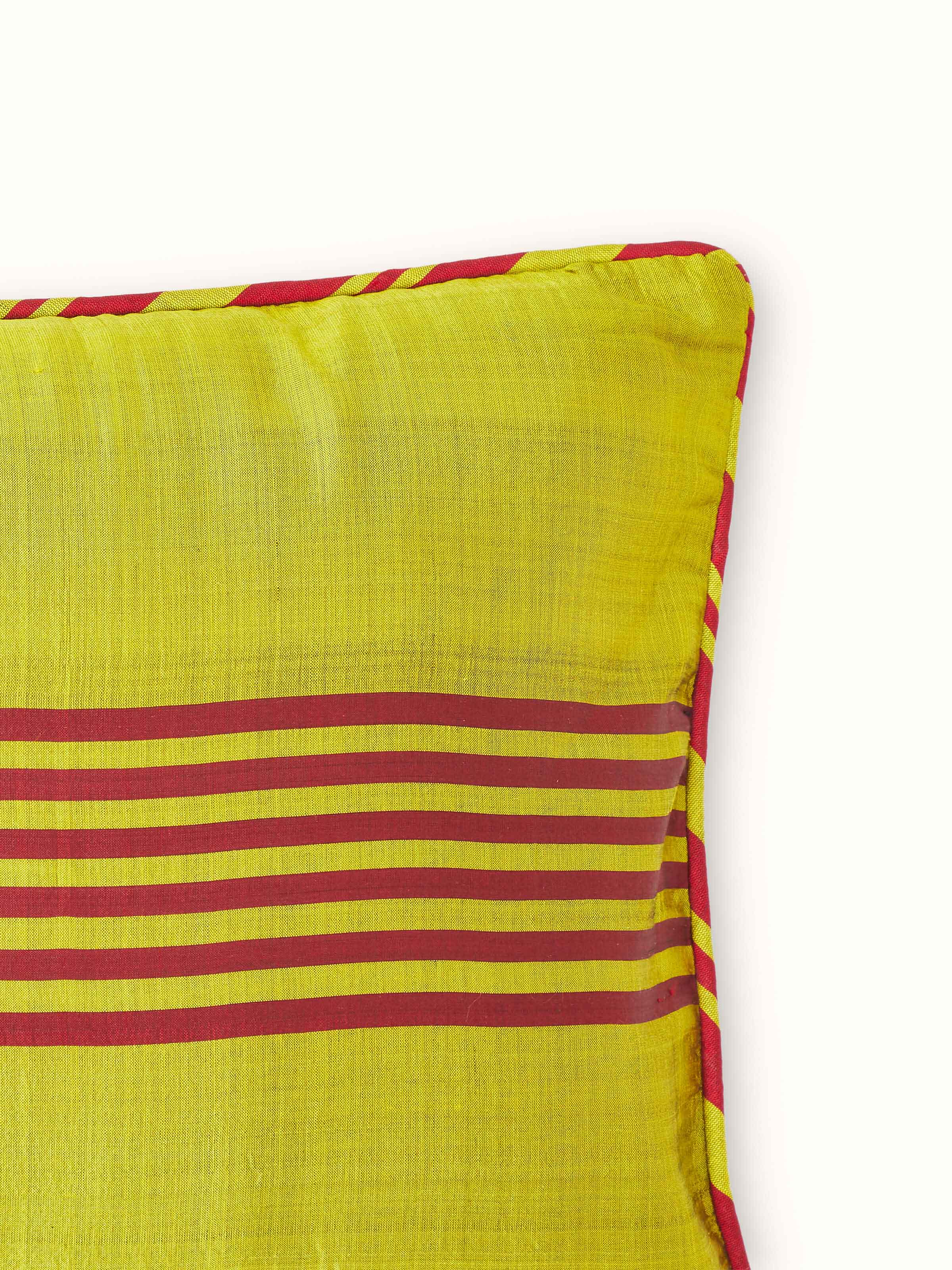 Side view of Bhoomi Yellow Stripe Silk Odisha Ikat Handloom Cushion Cover, demonstrating its thickness and the quality of silk.