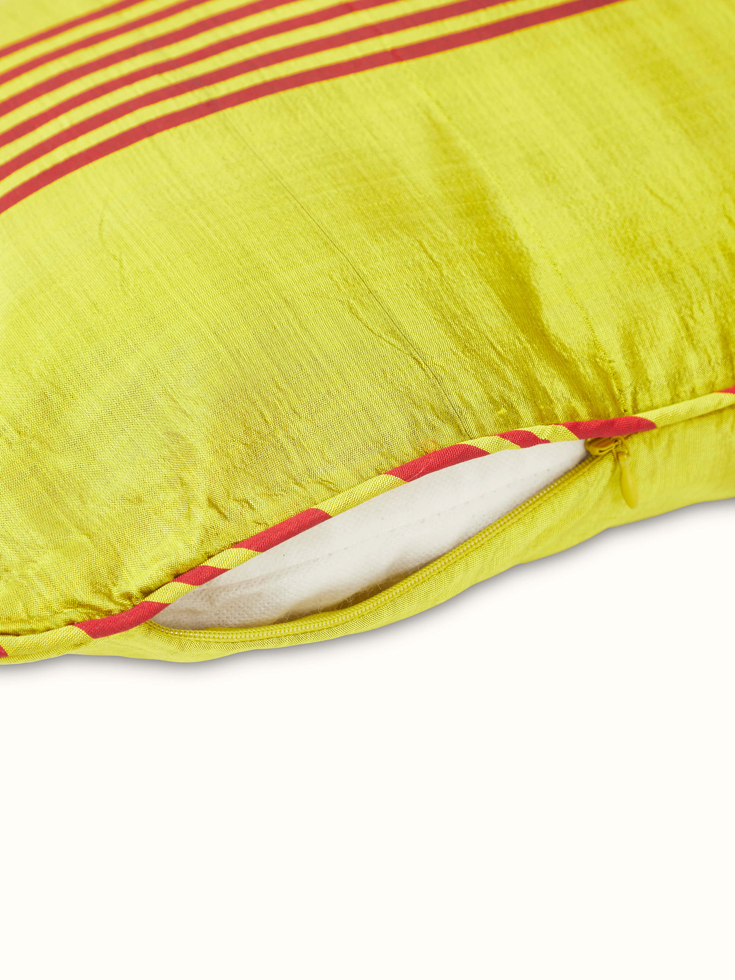Detailed view of Bhoomi Yellow Stripe Silk Odisha Ikat Handloom Cushion Cover, focusing on the yellow stripe and ikat design.