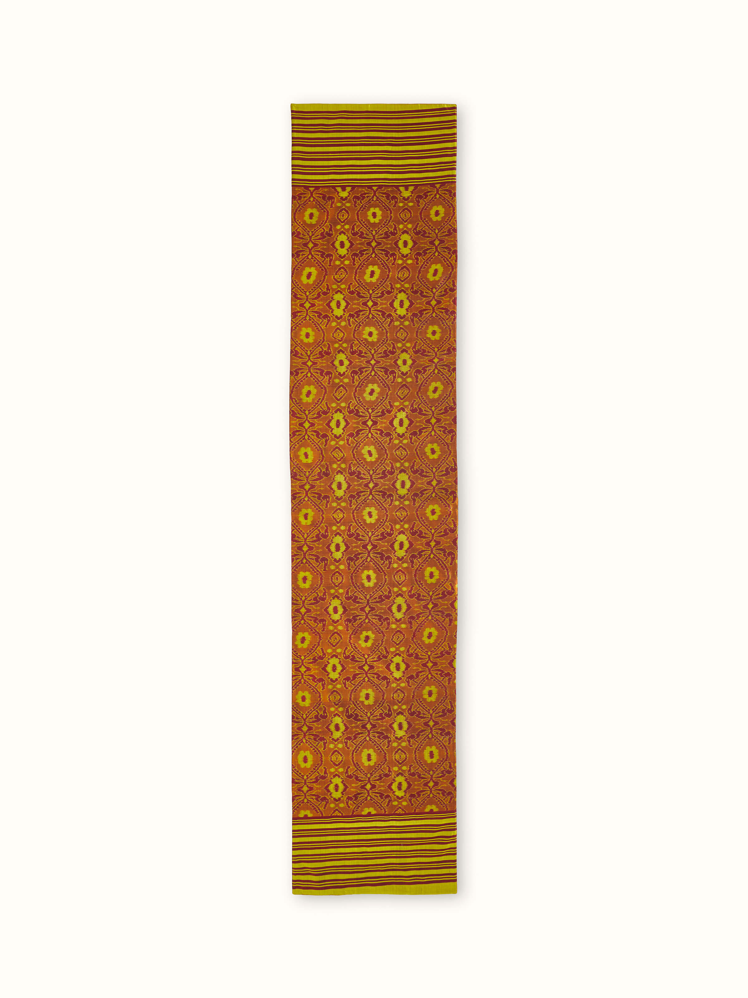 Front view of Bhoomi red silk Odisha Ikat bed runner with bold allover stripe pattern in traditional weave