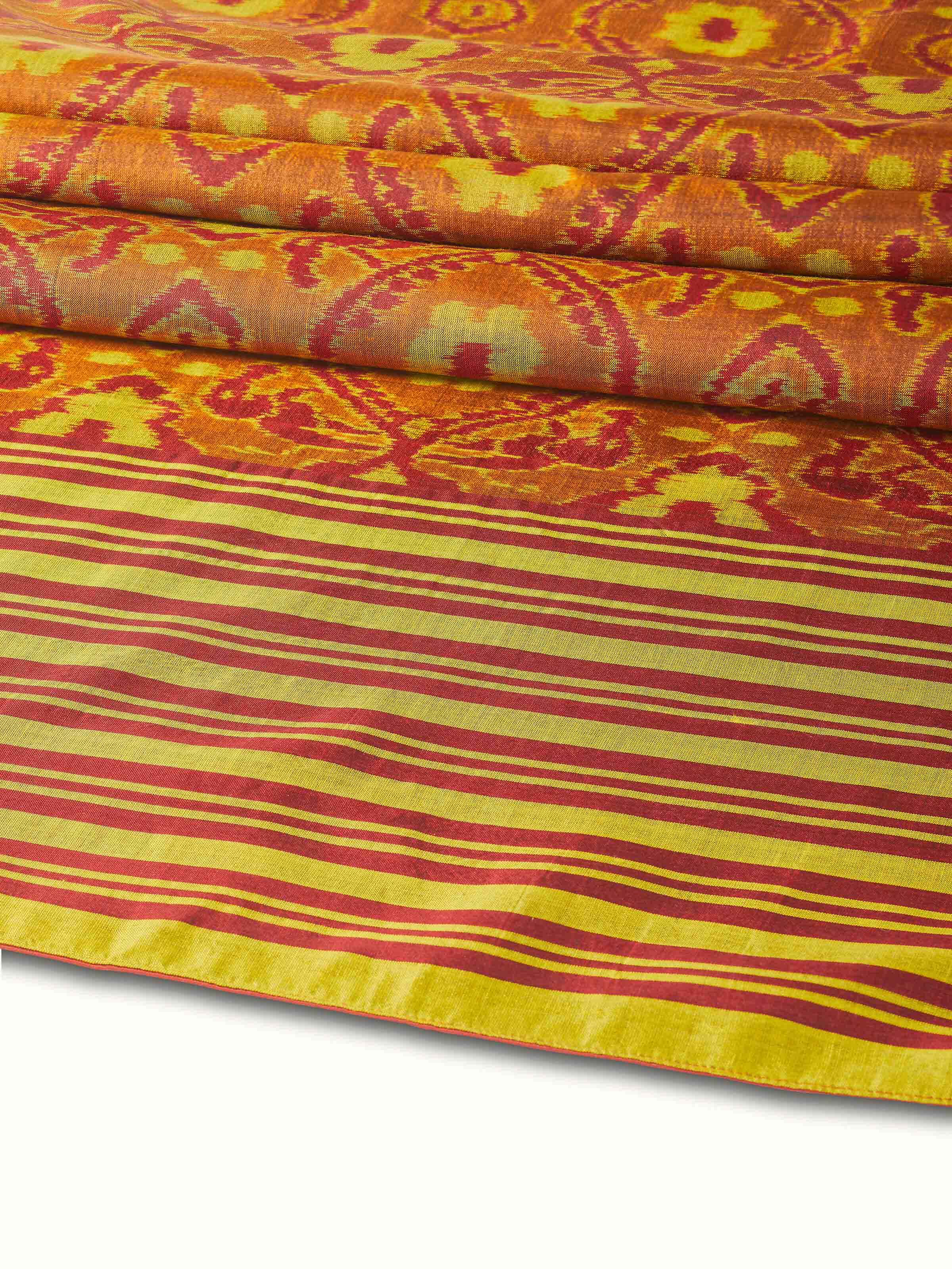 Detail view highlighting handwoven silk texture and color precision in Bhoomi red Ikat bed runner