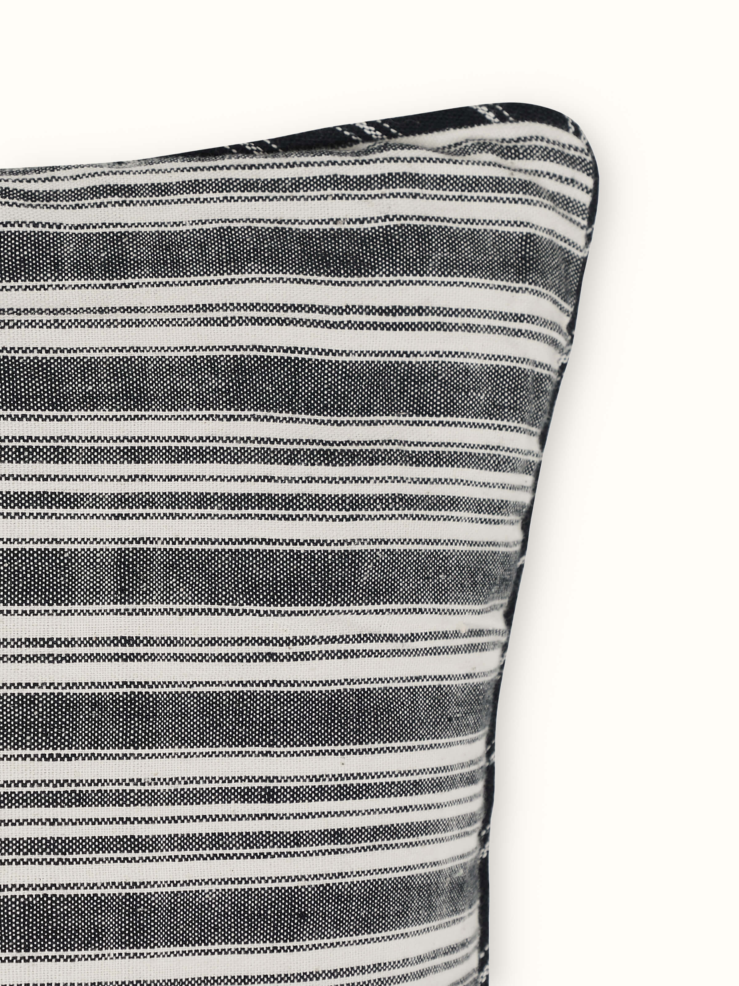 Close-up of Ujjal black kaya cotton handloom cushion cover, emphasizing the fine handloom weave and rich black color.