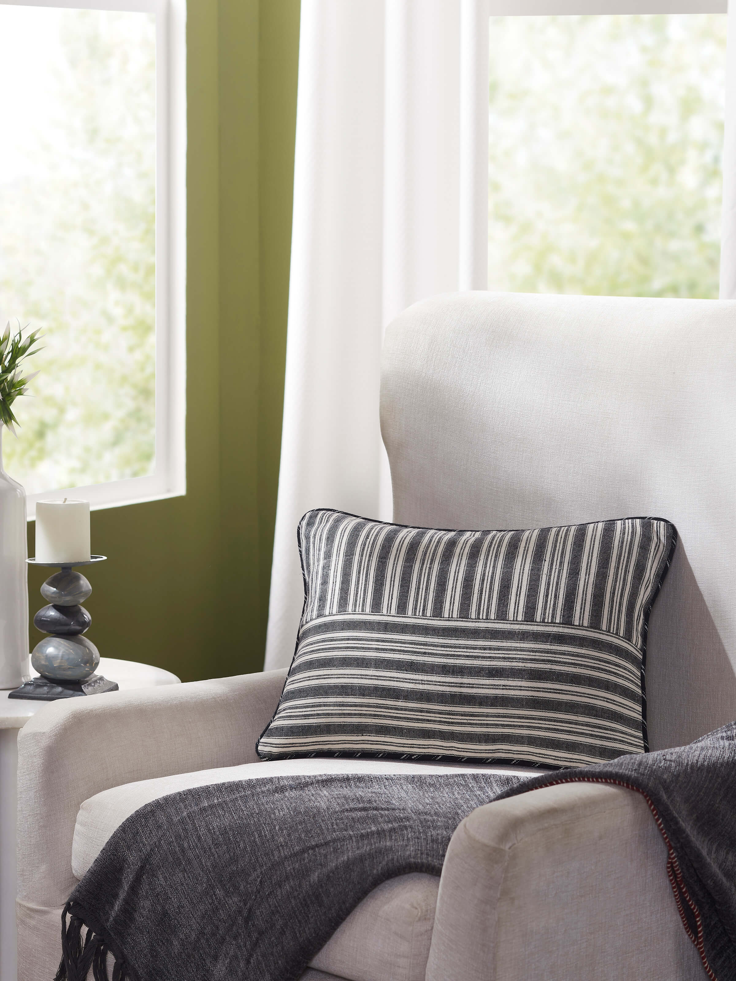 Close-up view of Krsna black kaza cotton handloom cushion cover showing the detailed handloom weave and texture.