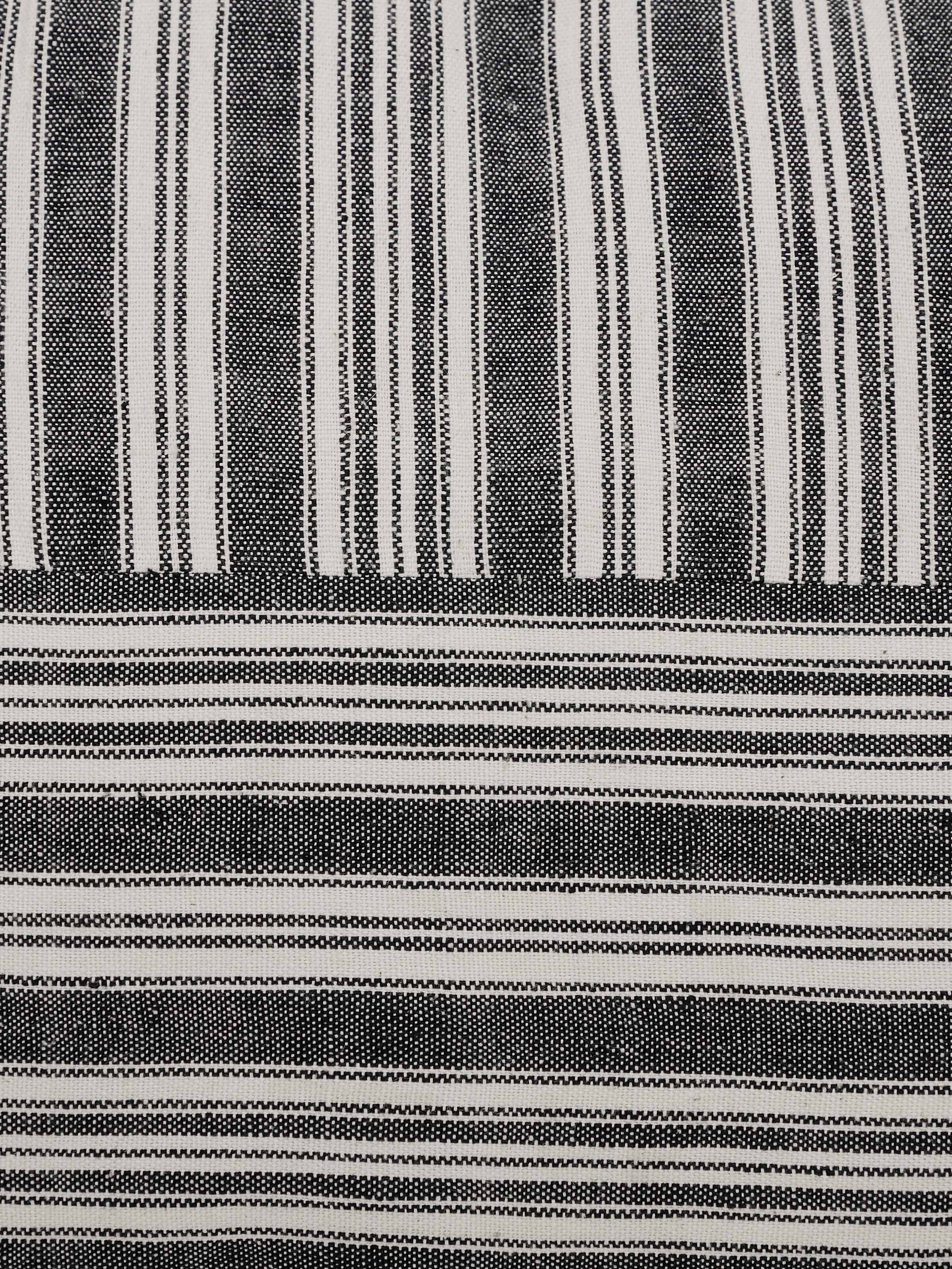 Perspective view of Krsna black kaza cotton handloom cushion cover showcasing the overall design and handloom texture.
