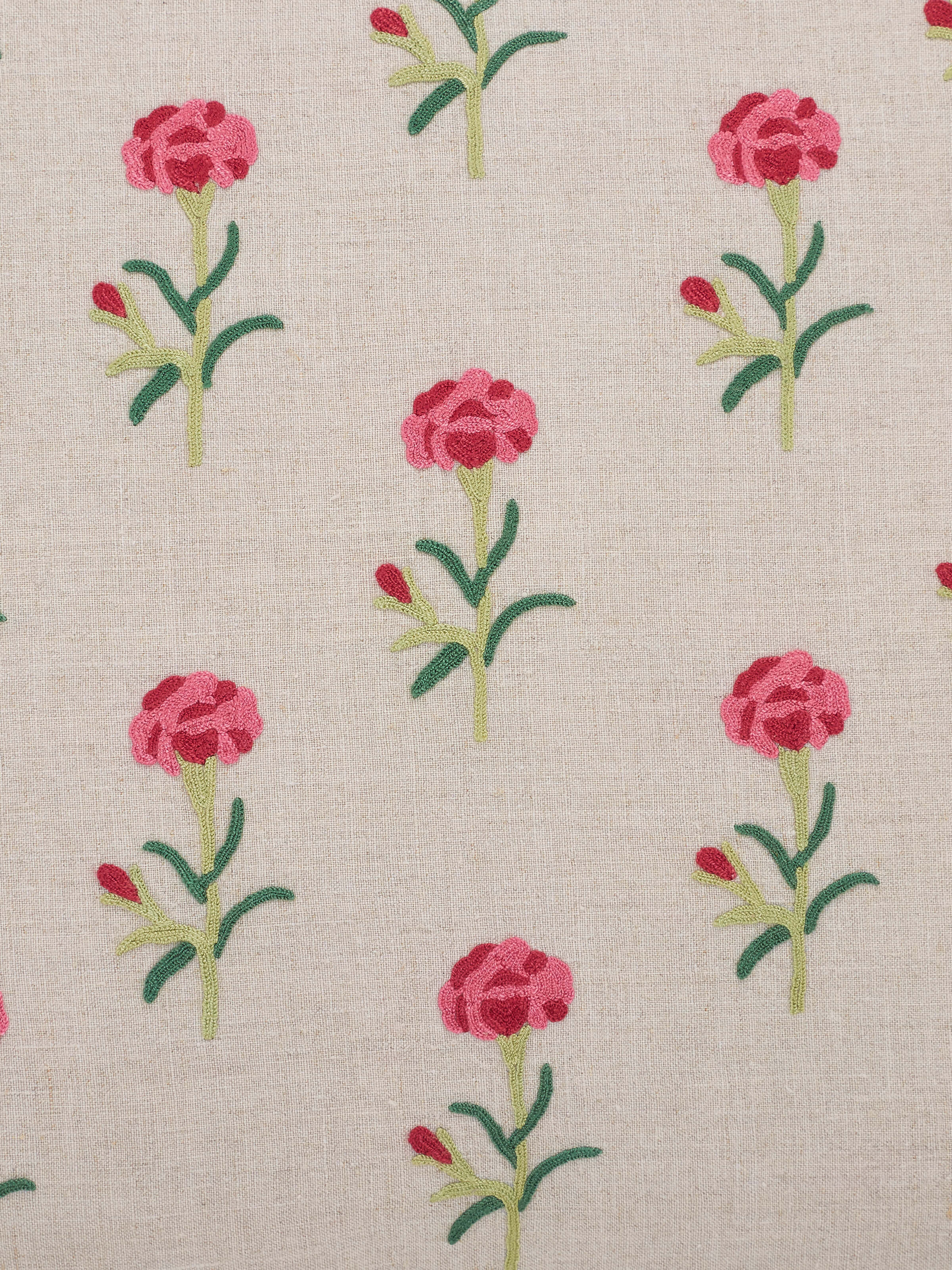 Detailed view of Mughal miniature magenta buti linen crewel hand embroidered cushion cover, highlighting the embroidery patterns and fabric quality.