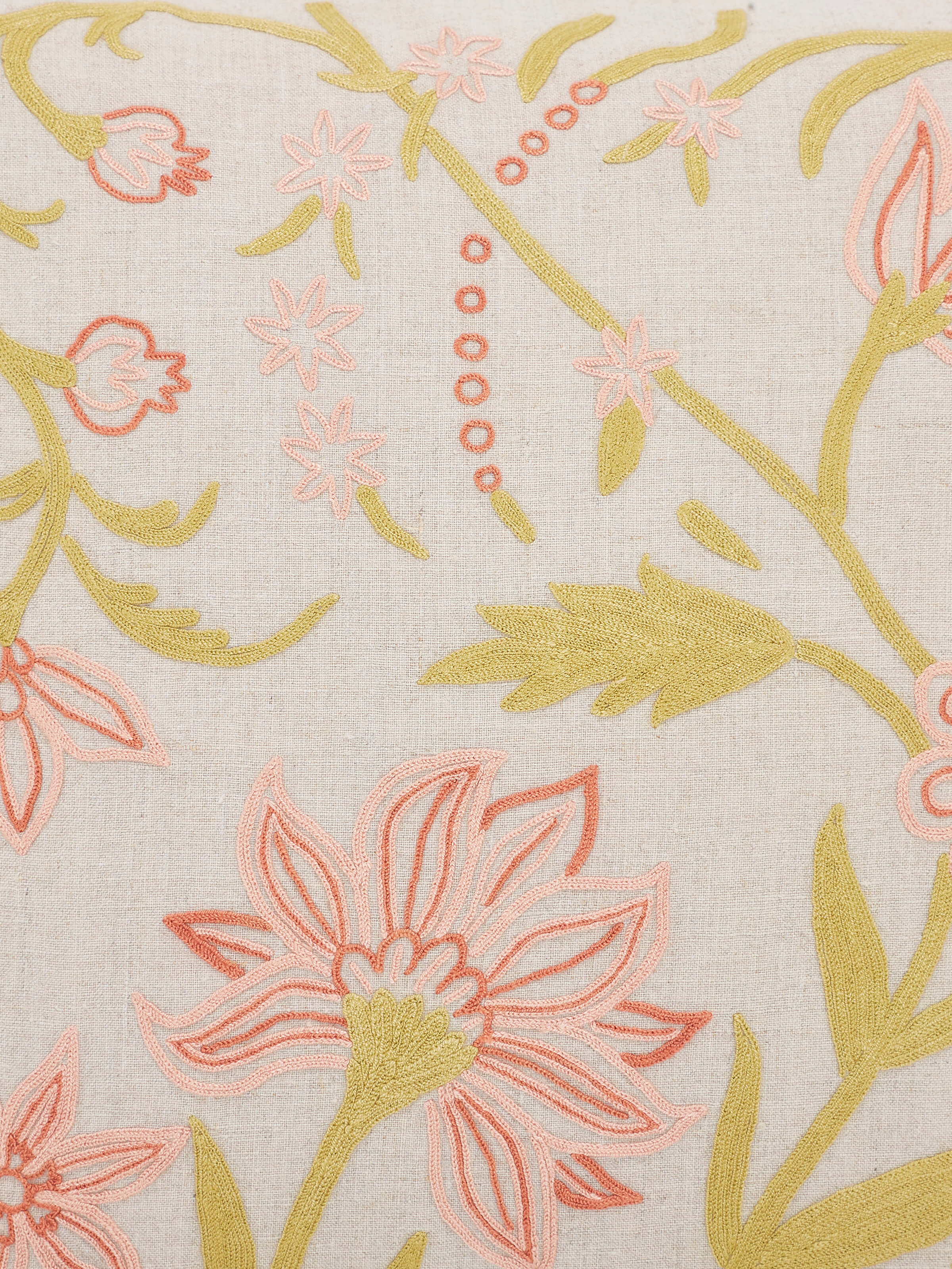 Detailed close-up of Mansur peach jaal linen crewel hand-embroidered cushion cover focusing on the hand-stitched patterns