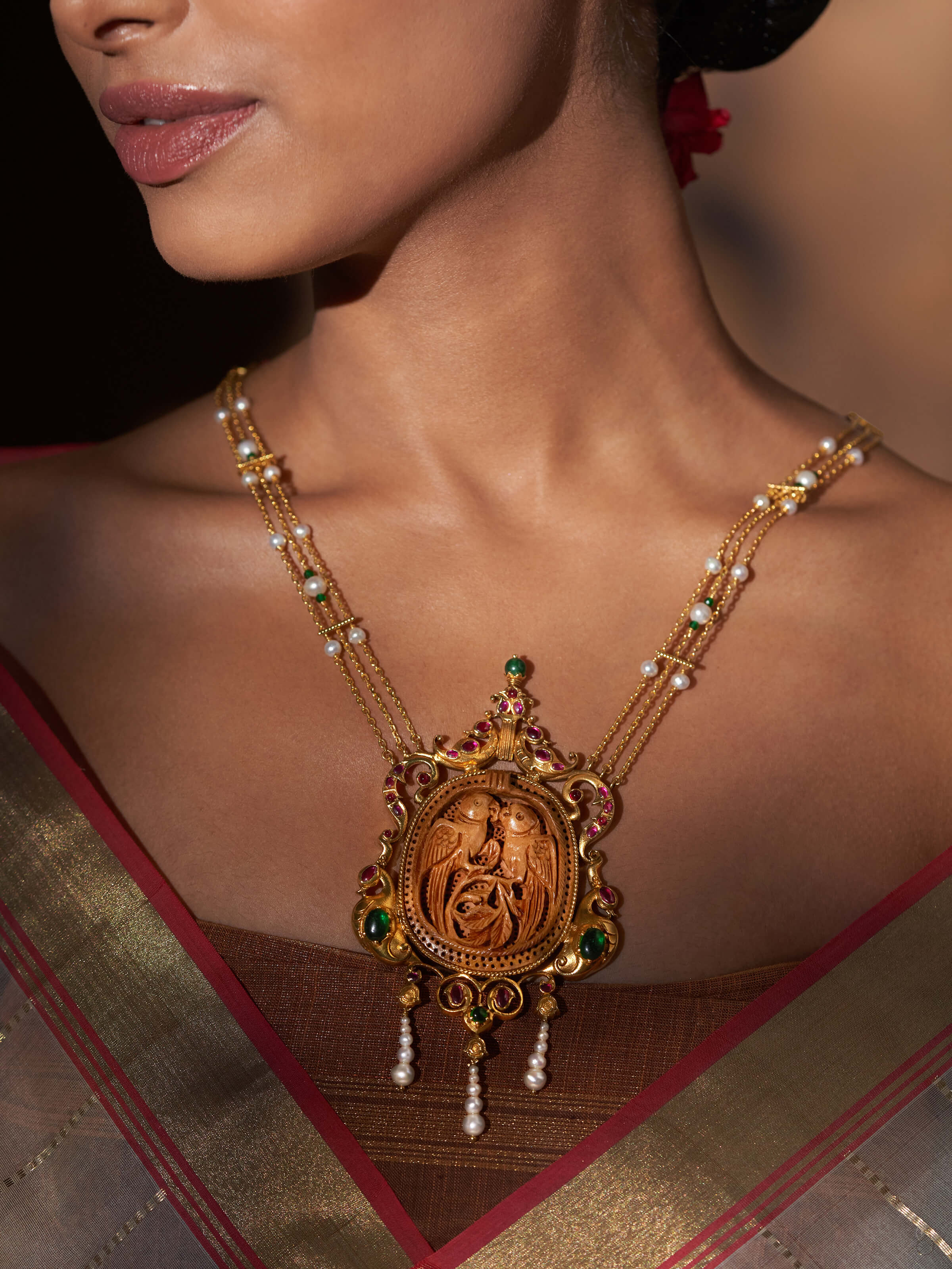 Side view of carved wood & silver long necklace highlighting the unique design and craftsmanship