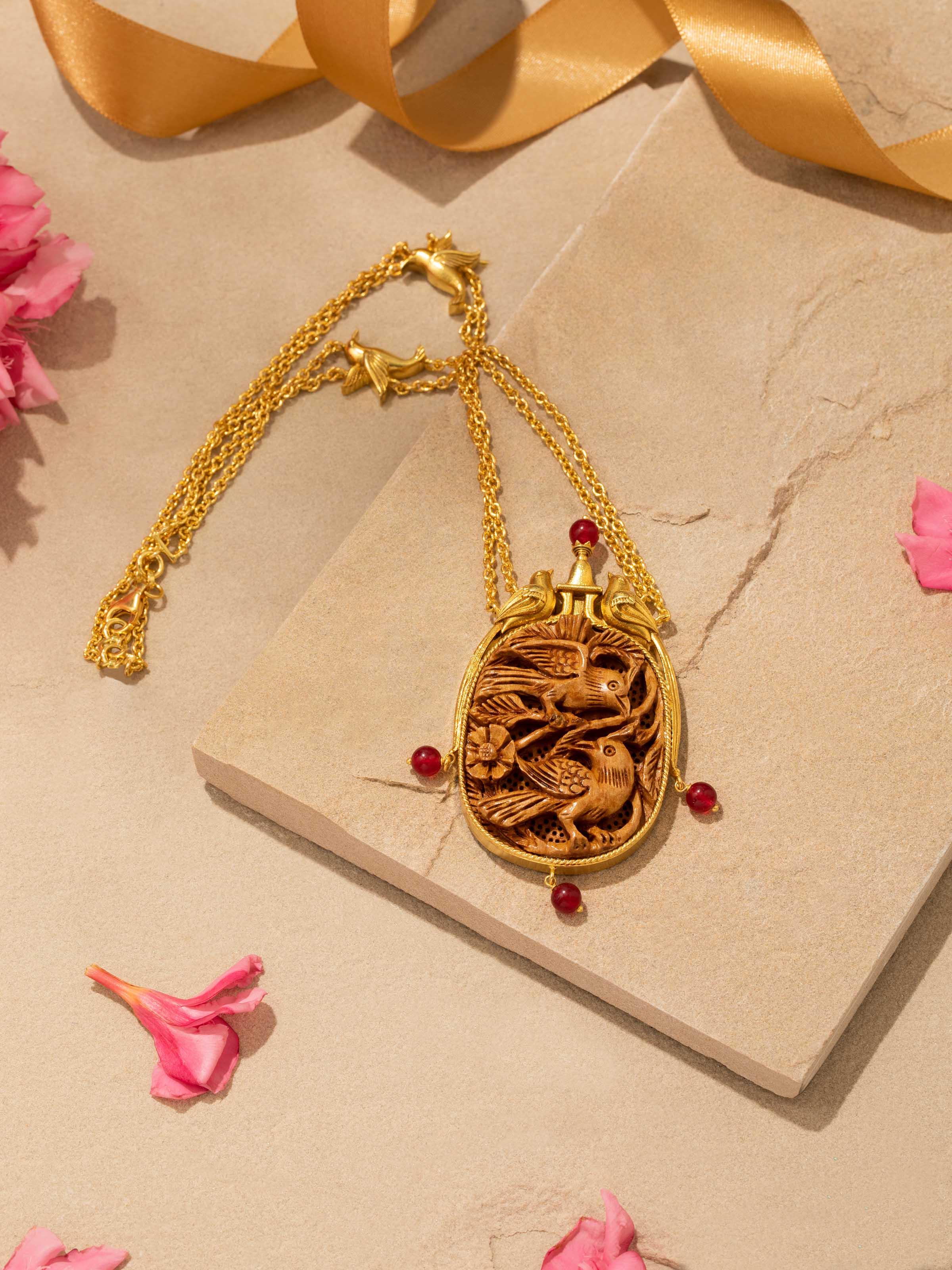 Detailed view of Carved Wood & Silver Long Necklace focusing on the craftsmanship of the wood and silver elements.