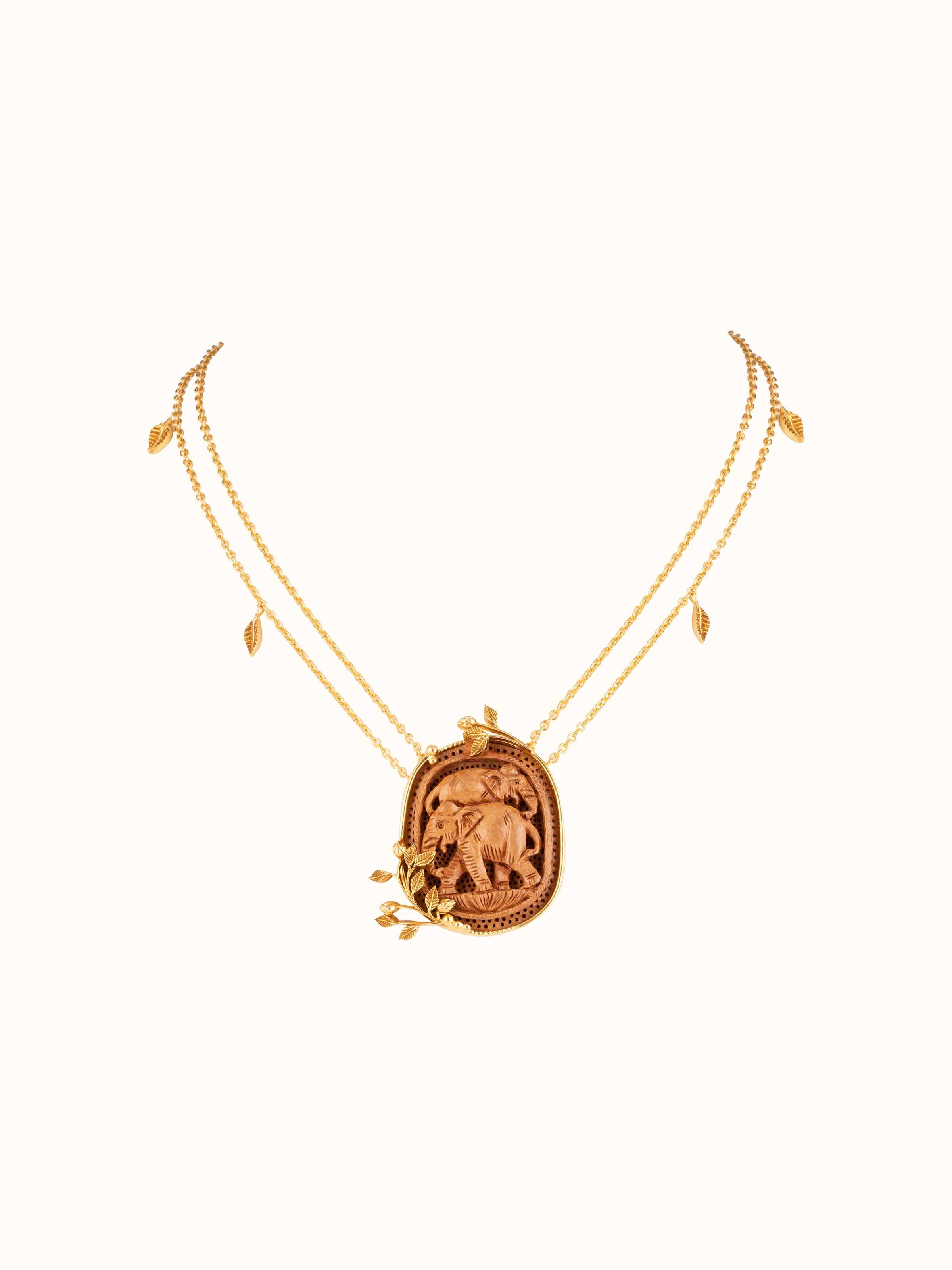 Front view of carved wood and silver necklace highlighting artisan textures