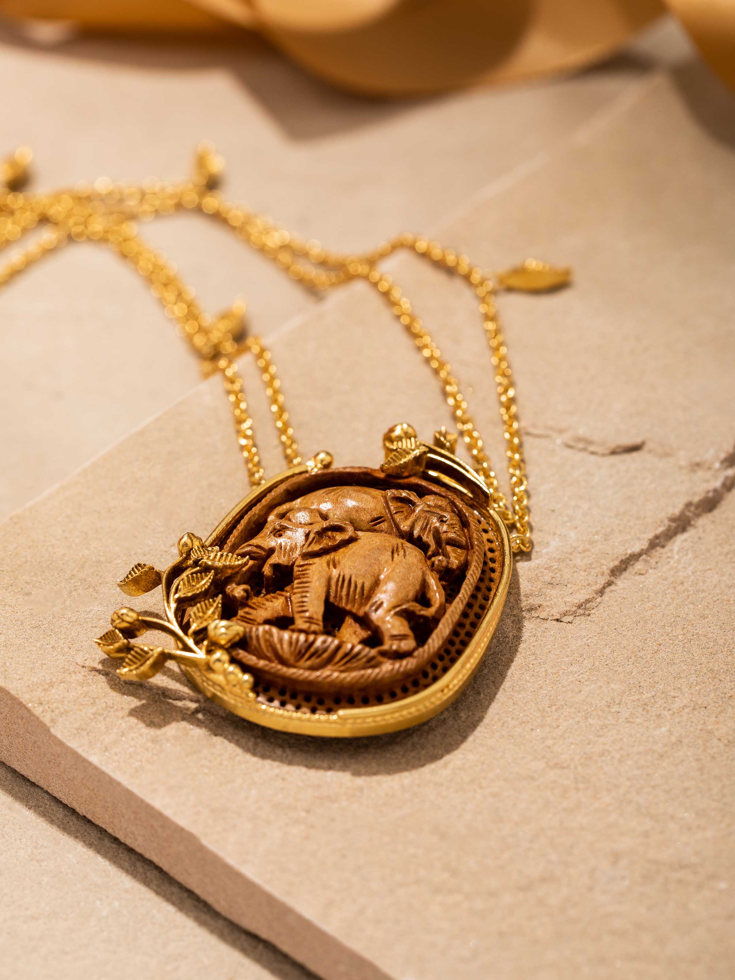 Second overhead view displaying necklace design with chain and pendant details