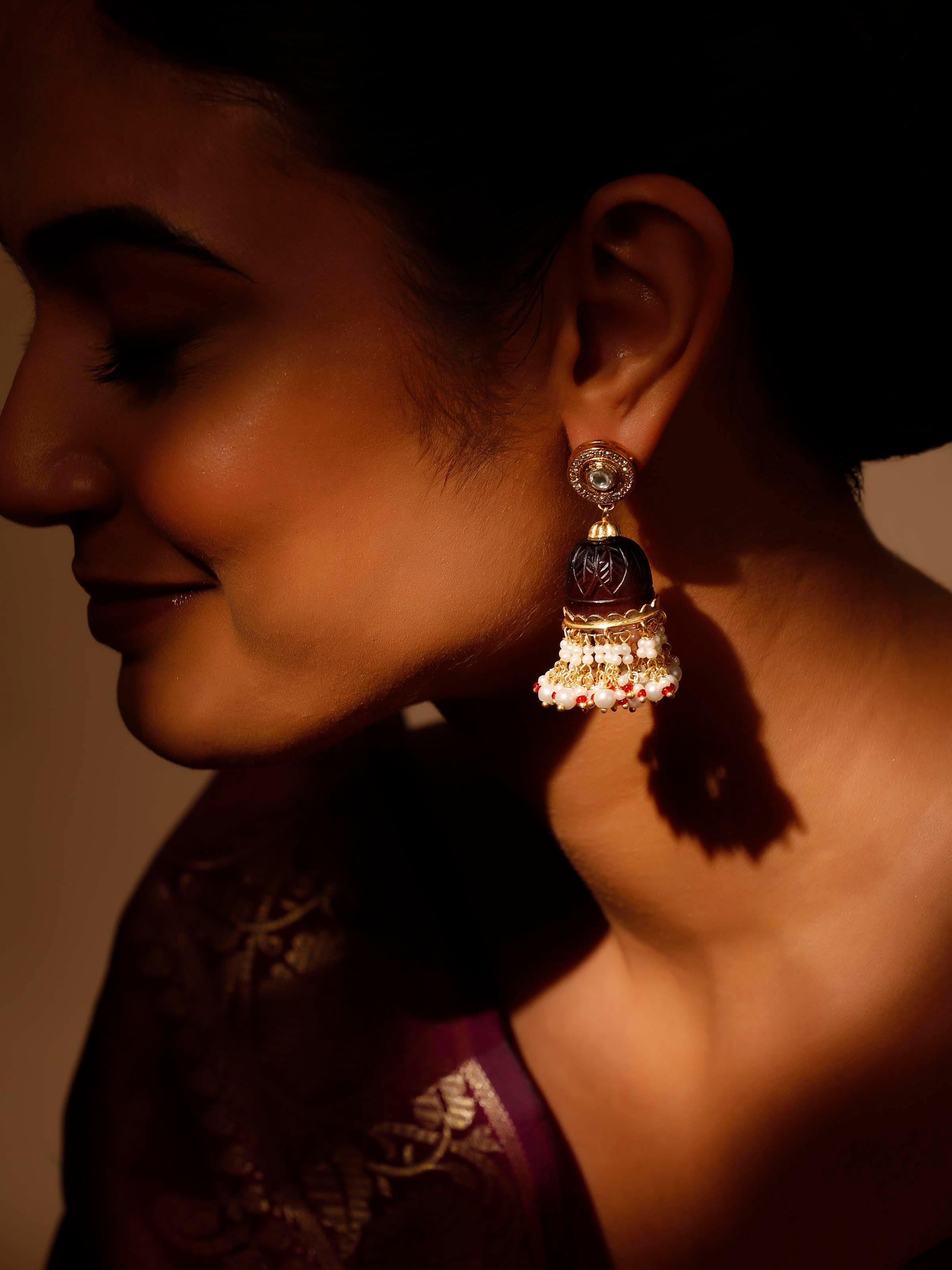 Angled view of Silver Smithing Jhumkas highlighting the ornate design and craftsmanship.