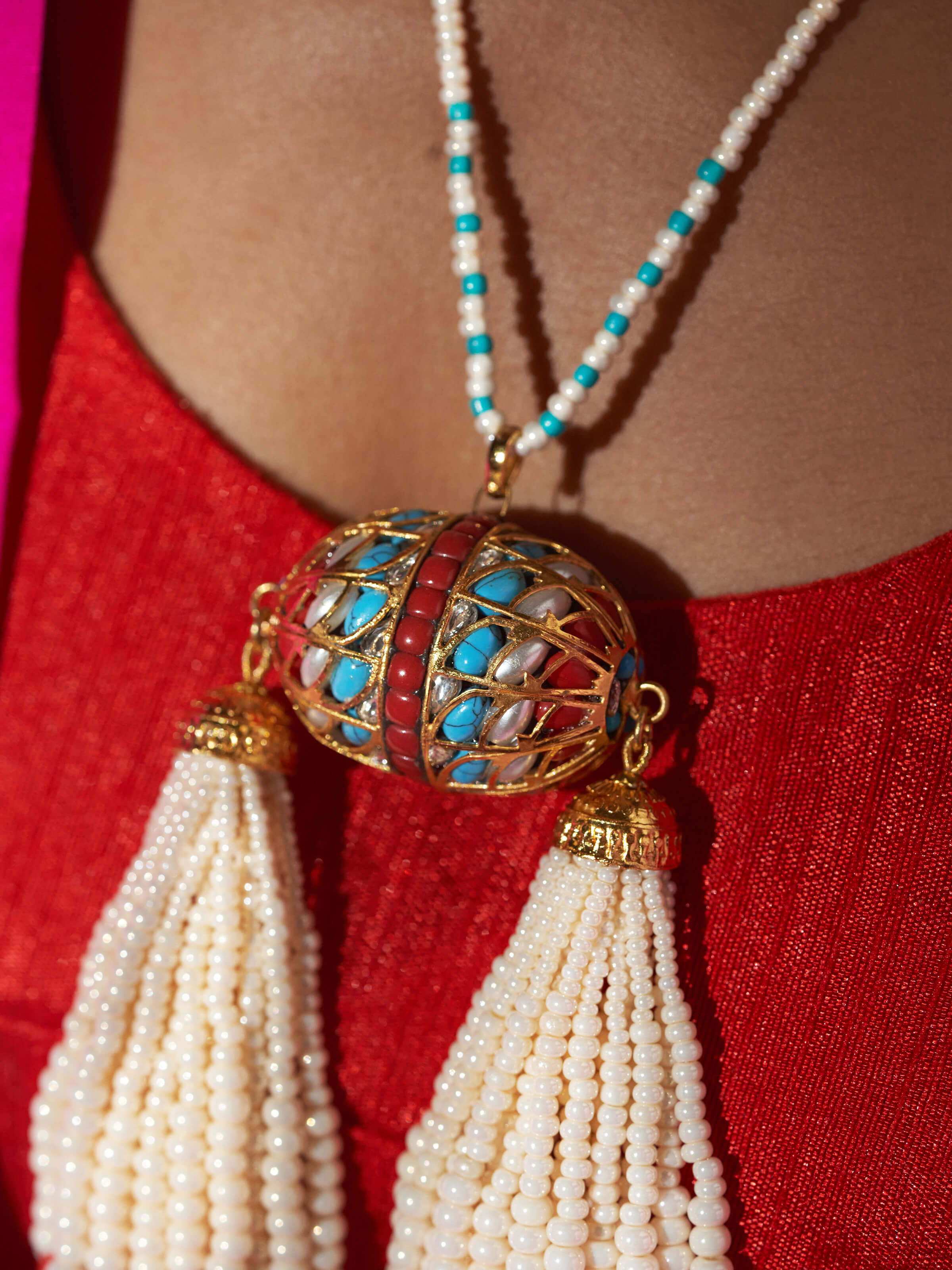 Overhead view of Bandhel Metal Long Necklace displaying the full length and intricate metalwork